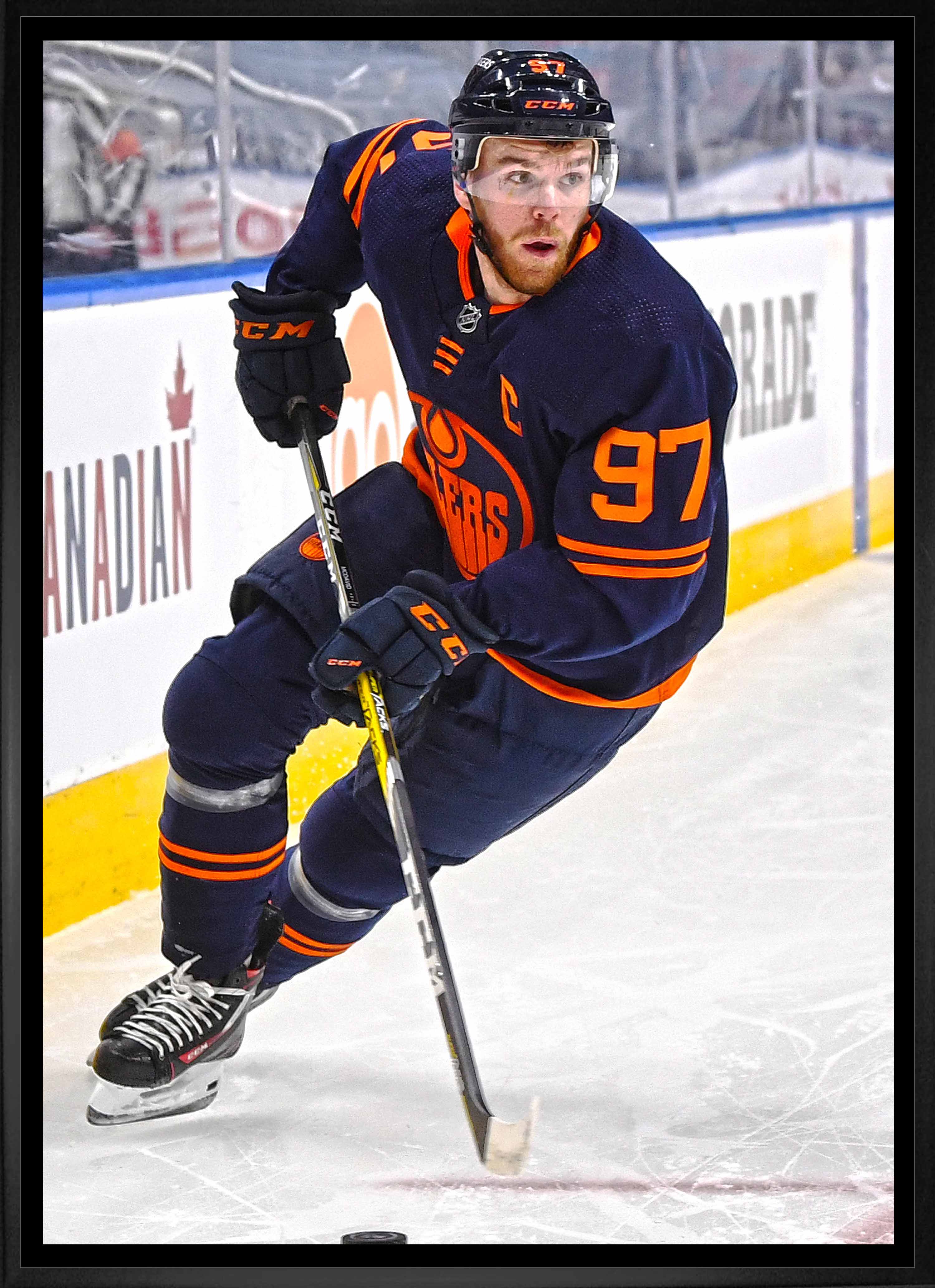 Connor McDavid Edmonton Oilers Framed 20" x 29" Skating with Puck Canvas