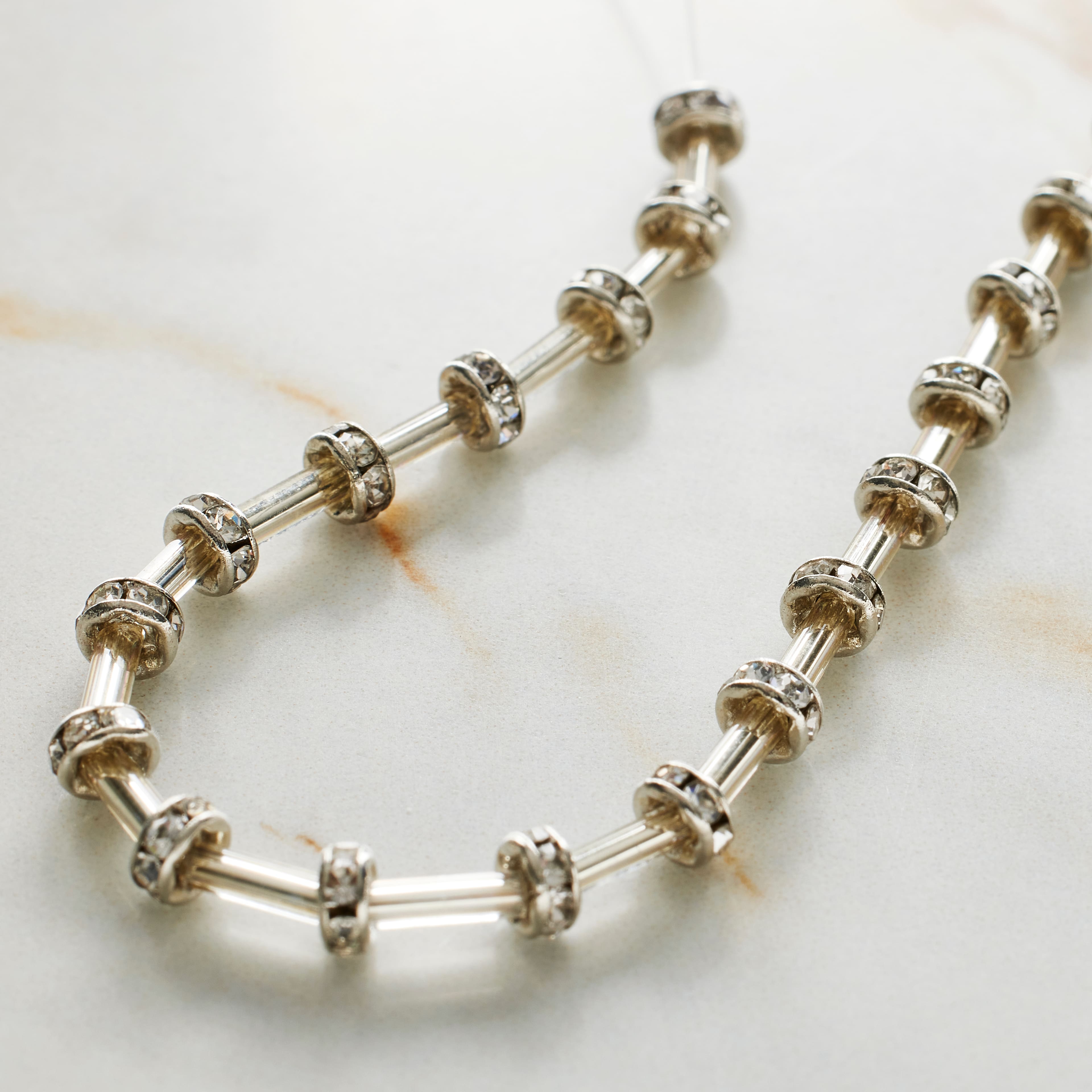 9 Packs: 19 ct. (171 total) Silver Rhinestone Studded Rondel Beads, 4mm by Bead Landing™