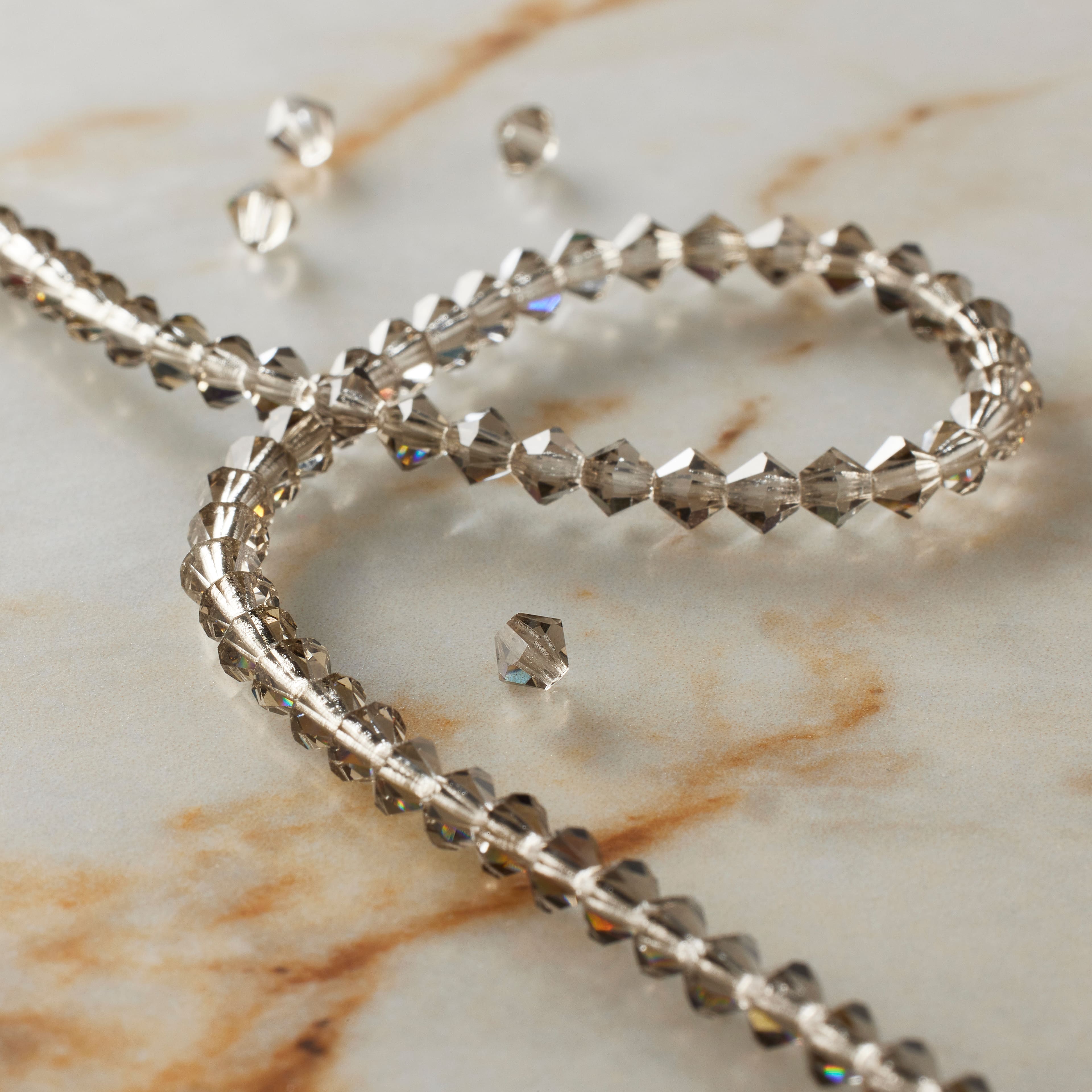 12 Pack: Preciosa Glass Crystal Bicone Beads, 4mm by Bead Landing™