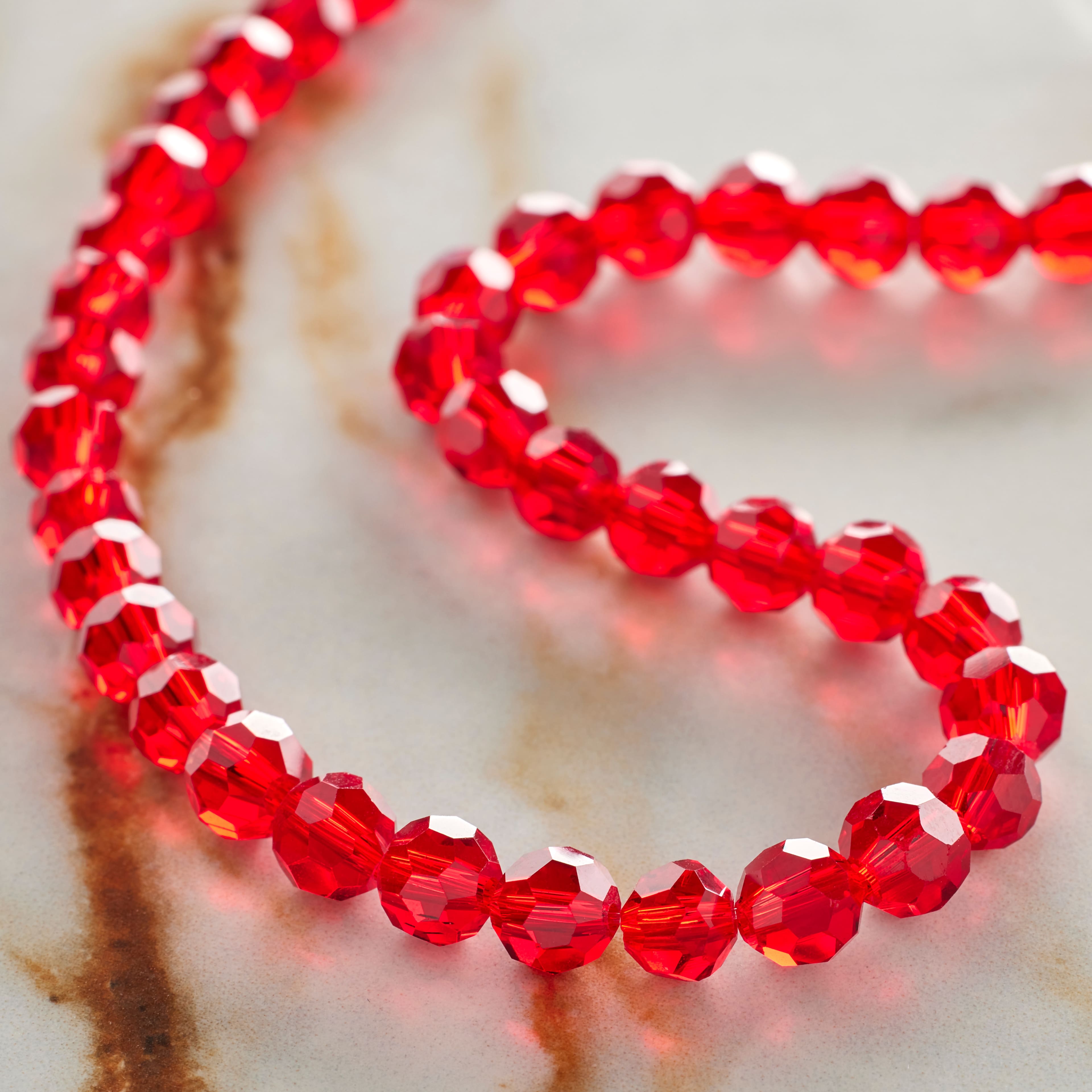 12 Pack: Ruby Faceted Glass Round Beads, 6mm by Bead Landing™