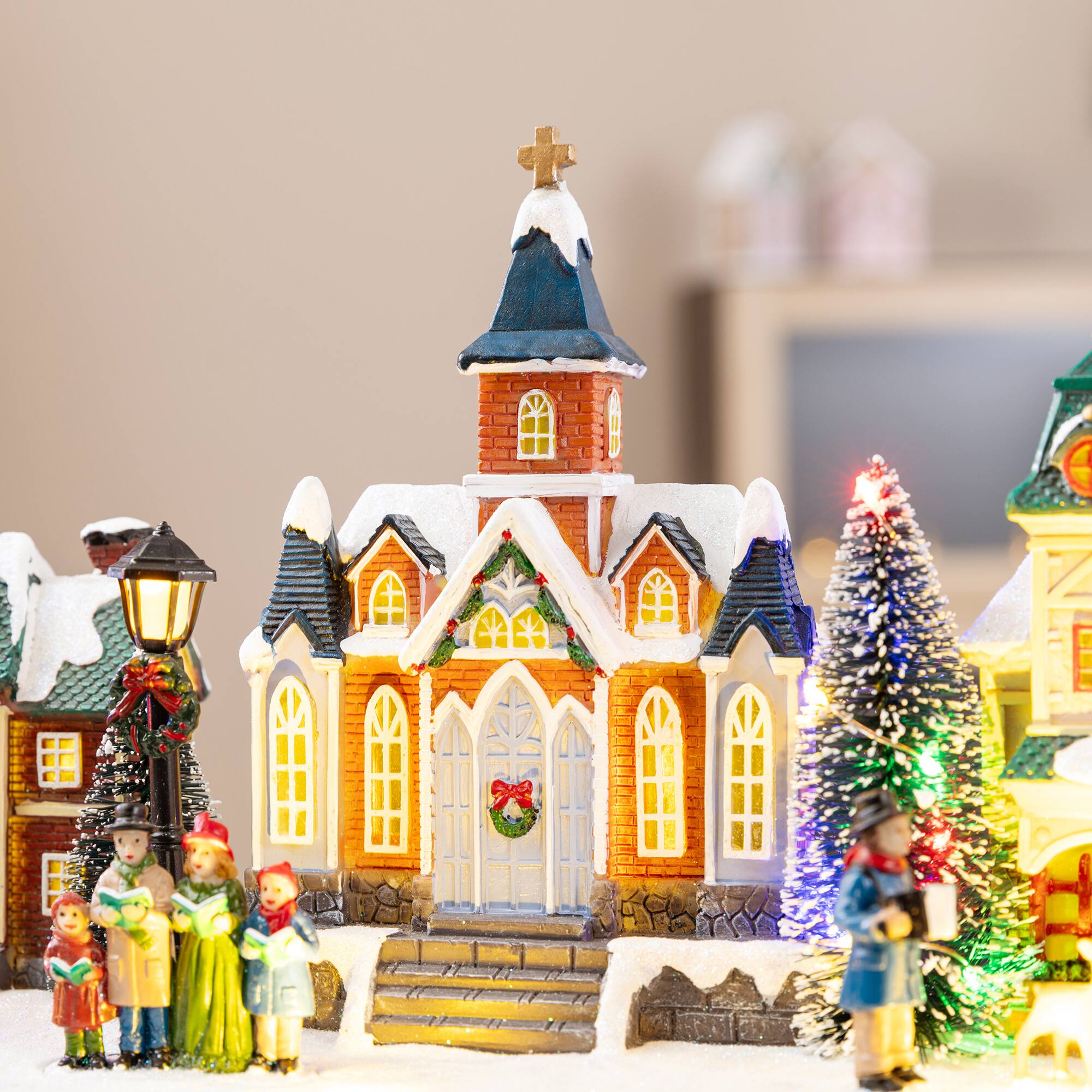 Glitzhome® 22" Lighted Christmas Santa Musical Resin Village with Timer