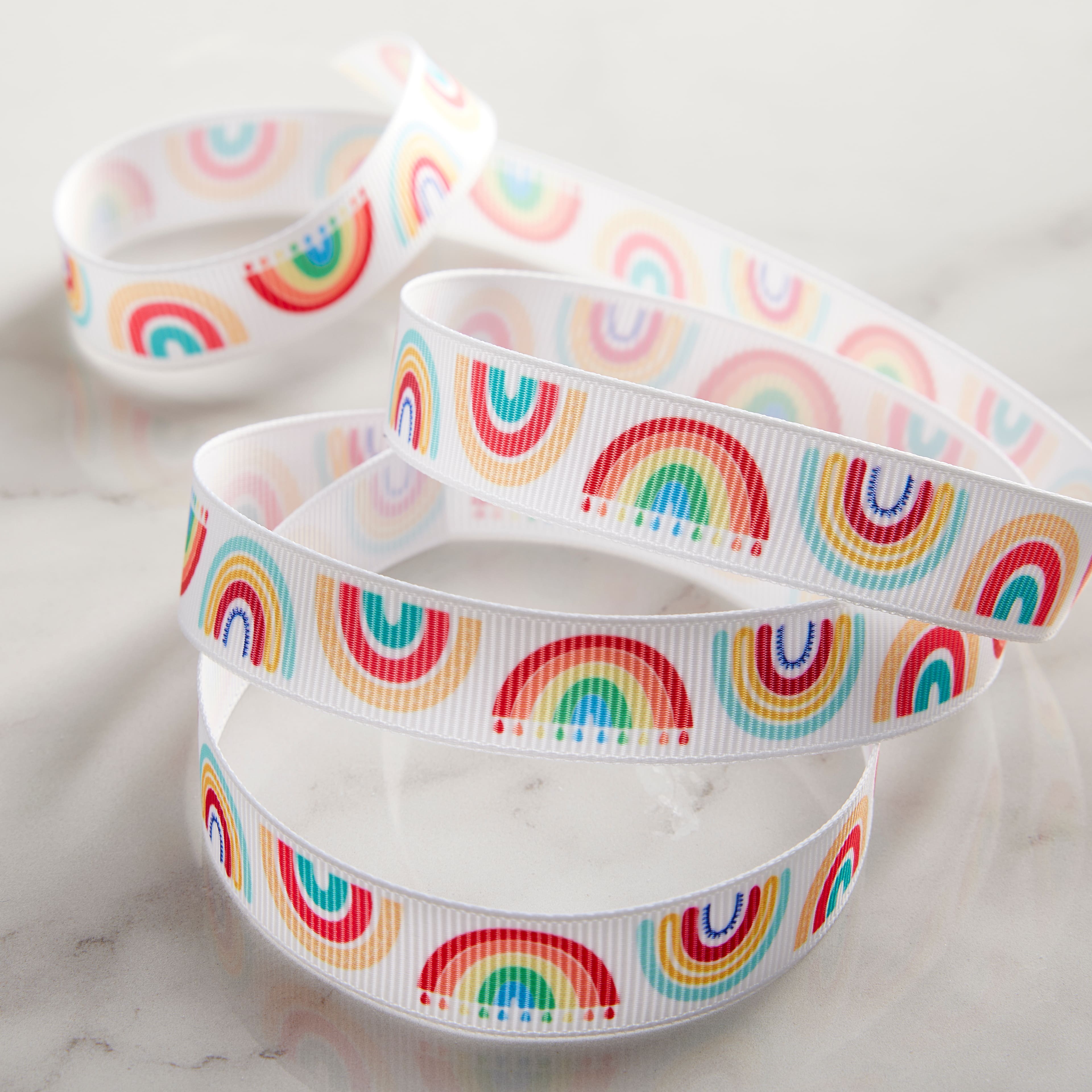 12 Pack: 5/8'' x 7yd. Grosgrain Rainbow Ribbon by Celebrate It®