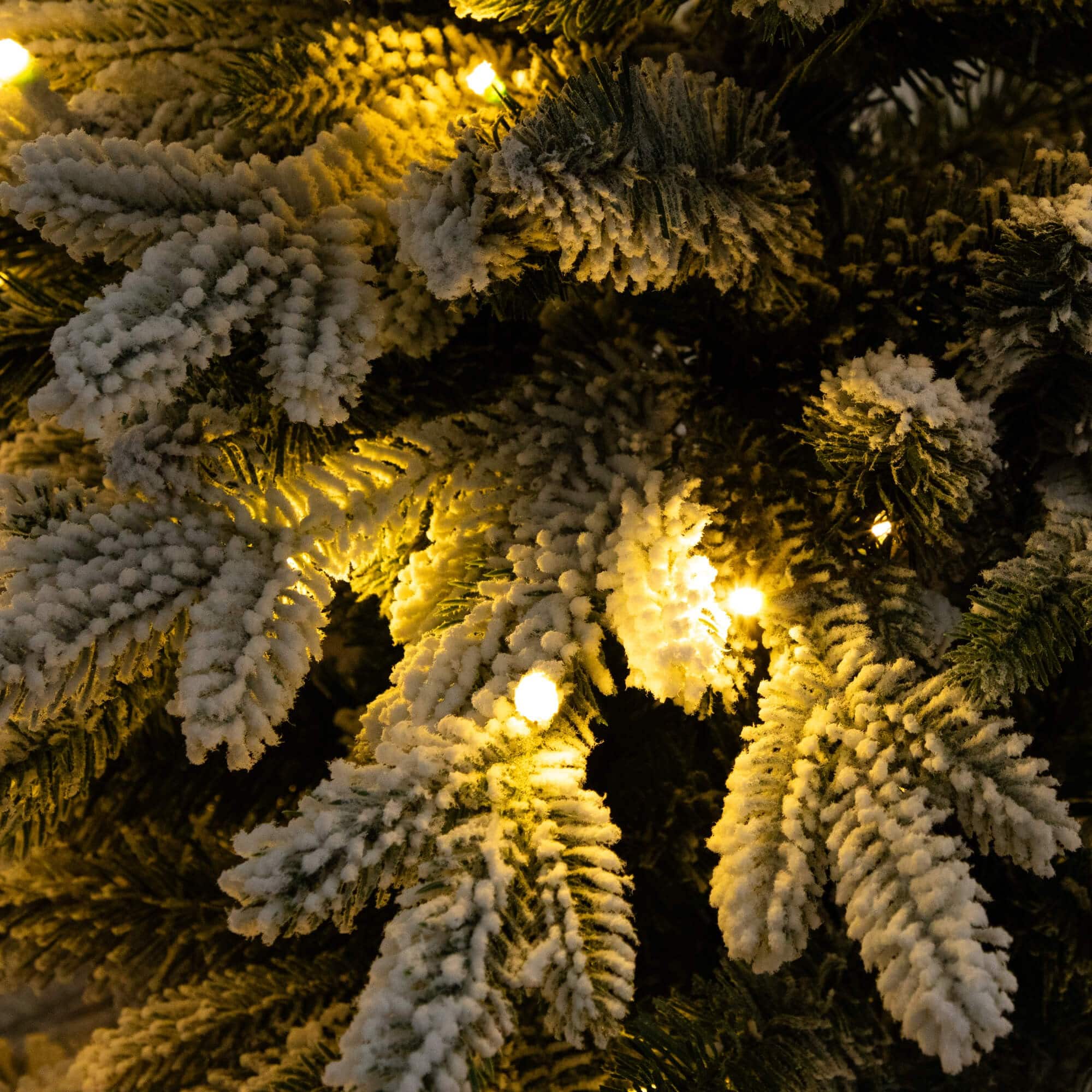 4ft. Pre-Lit Flocked Artificial Christmas Tree in Black Decorative Planter, Warm White LED Lights