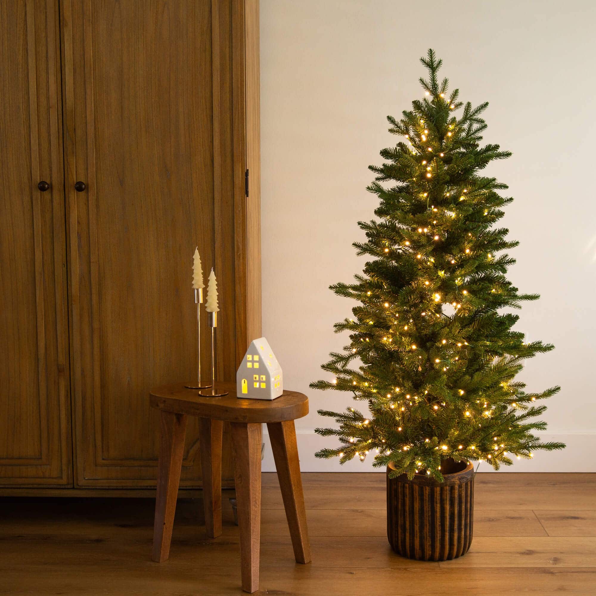 4.5ft. Pre-Lit Pine Artificial Christmas Tree in Decorative Planter with Clear LED Lights