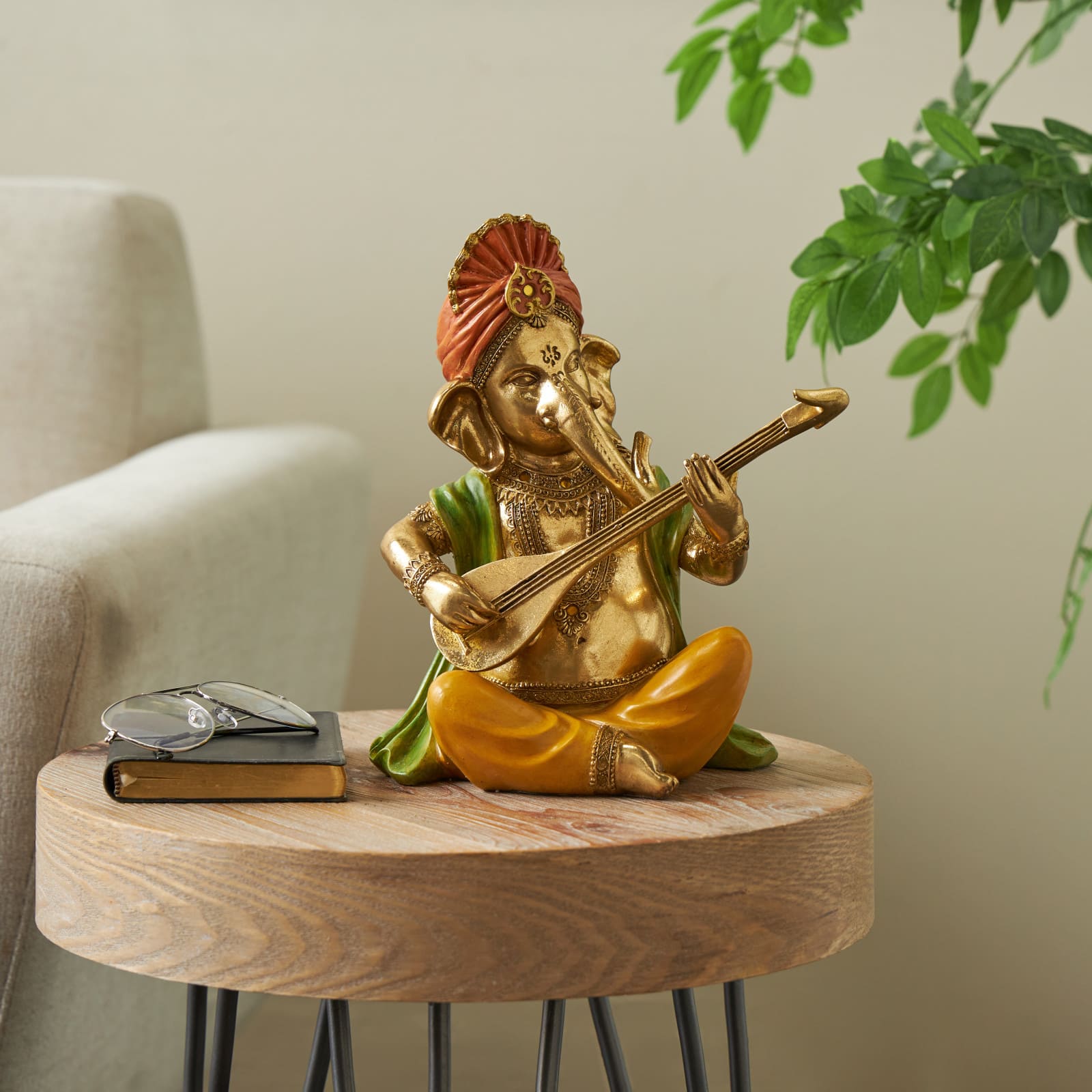 10.75" Gold Ganesh Musician Decorative Sculpture with Green, Yellow, and Red Accents
