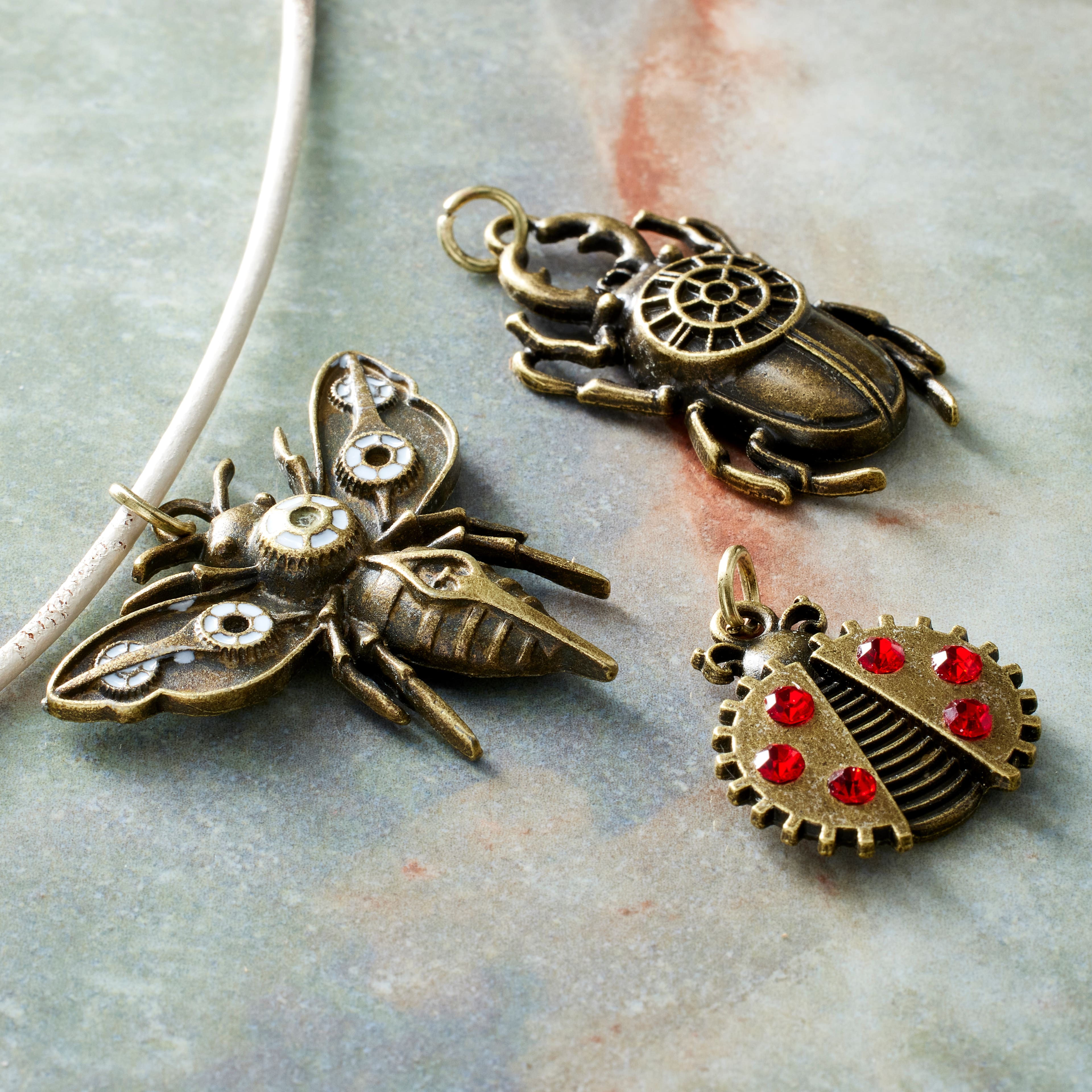 12 Packs: 3 ct. (36 total) Found Objects Bronze Oxide Bug Charms by Bead Landing™