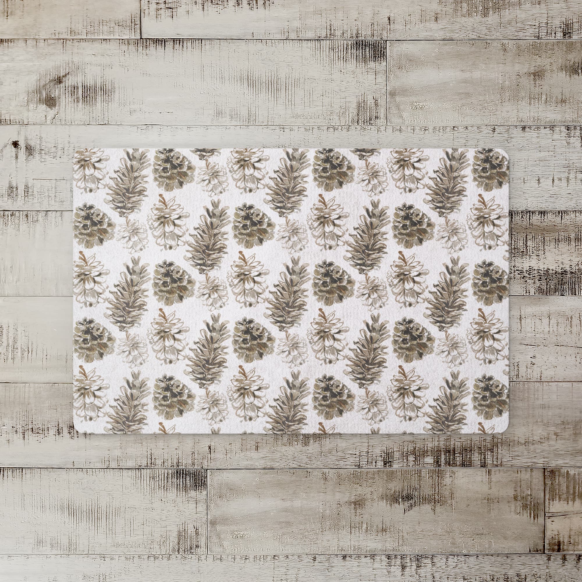 Pinecones on White Floor Mat