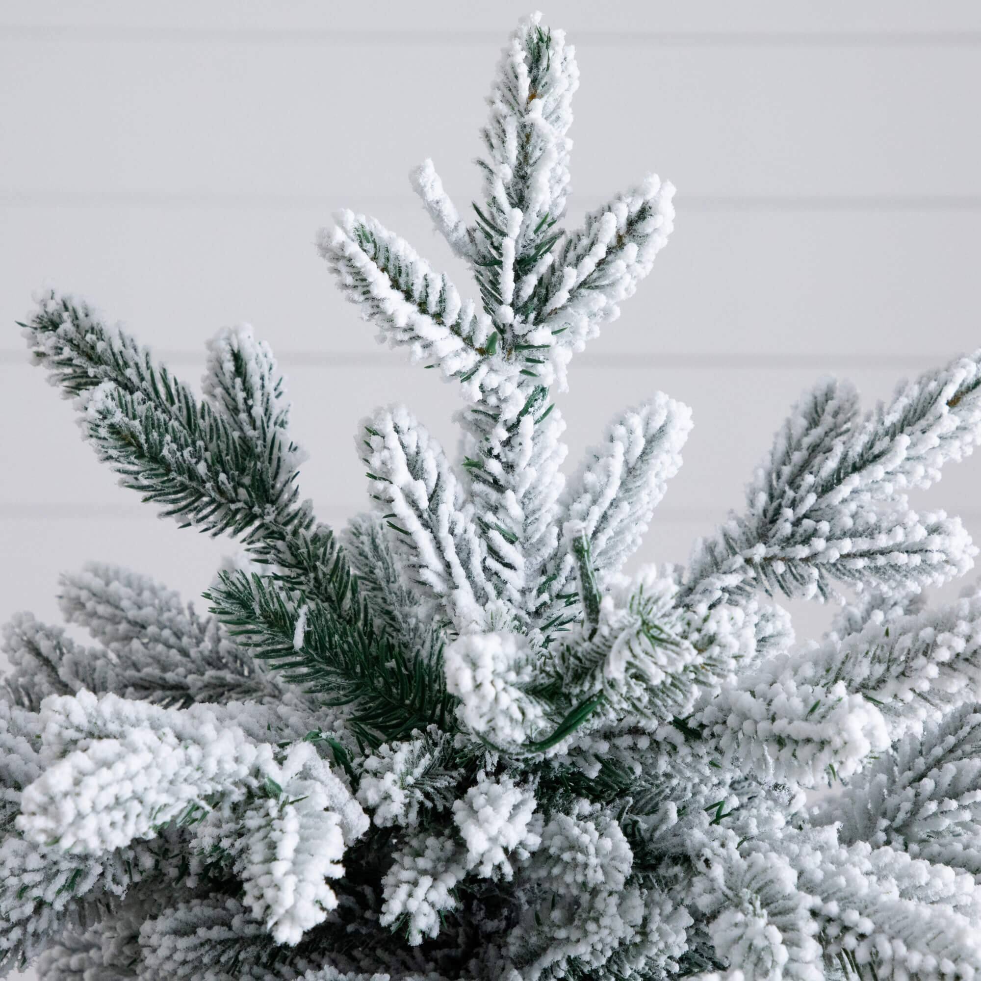4ft. Pre-Lit Flocked Artificial Christmas Tree in Black Decorative Planter, Warm White LED Lights