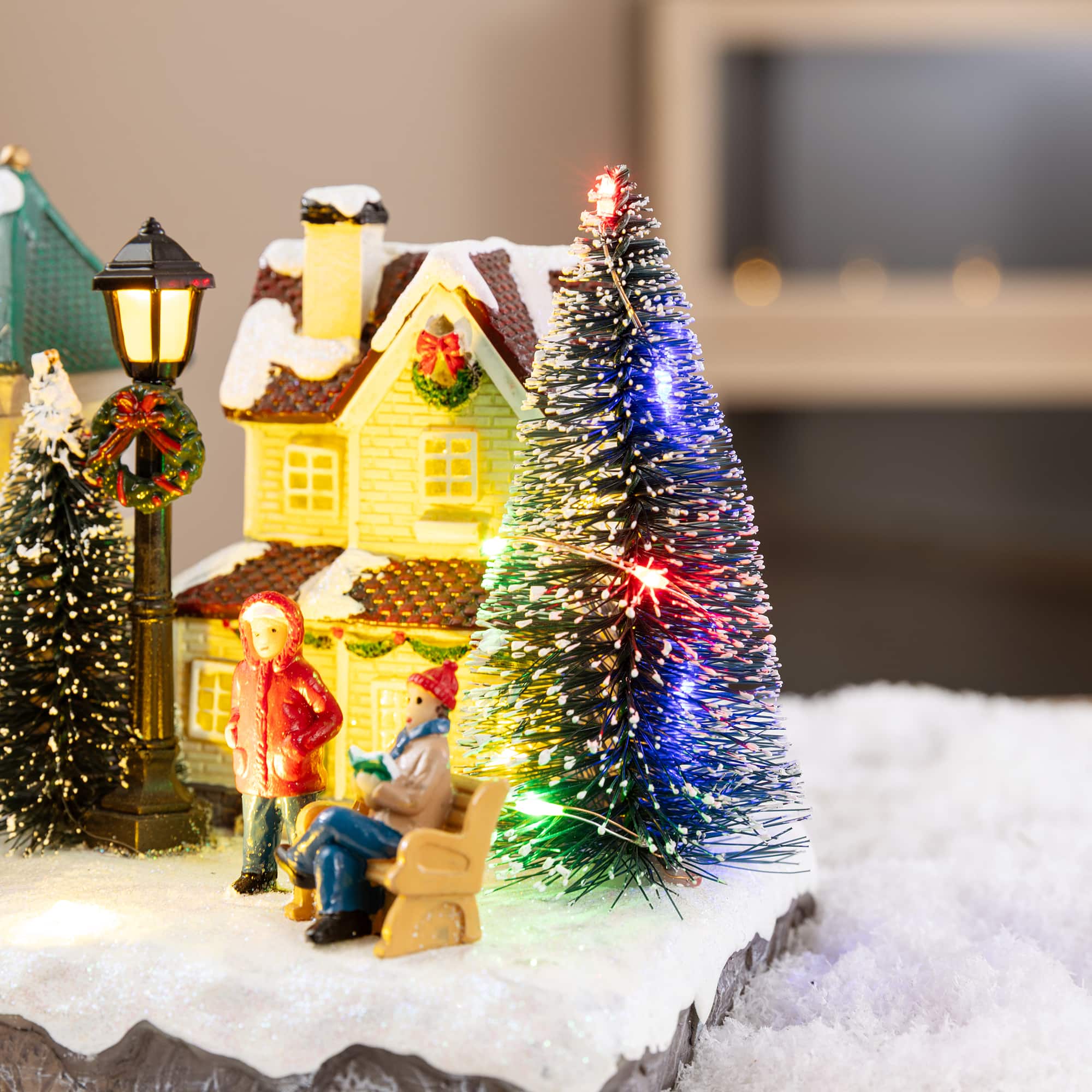Glitzhome® 22" Lighted Christmas Santa Musical Resin Village with Timer