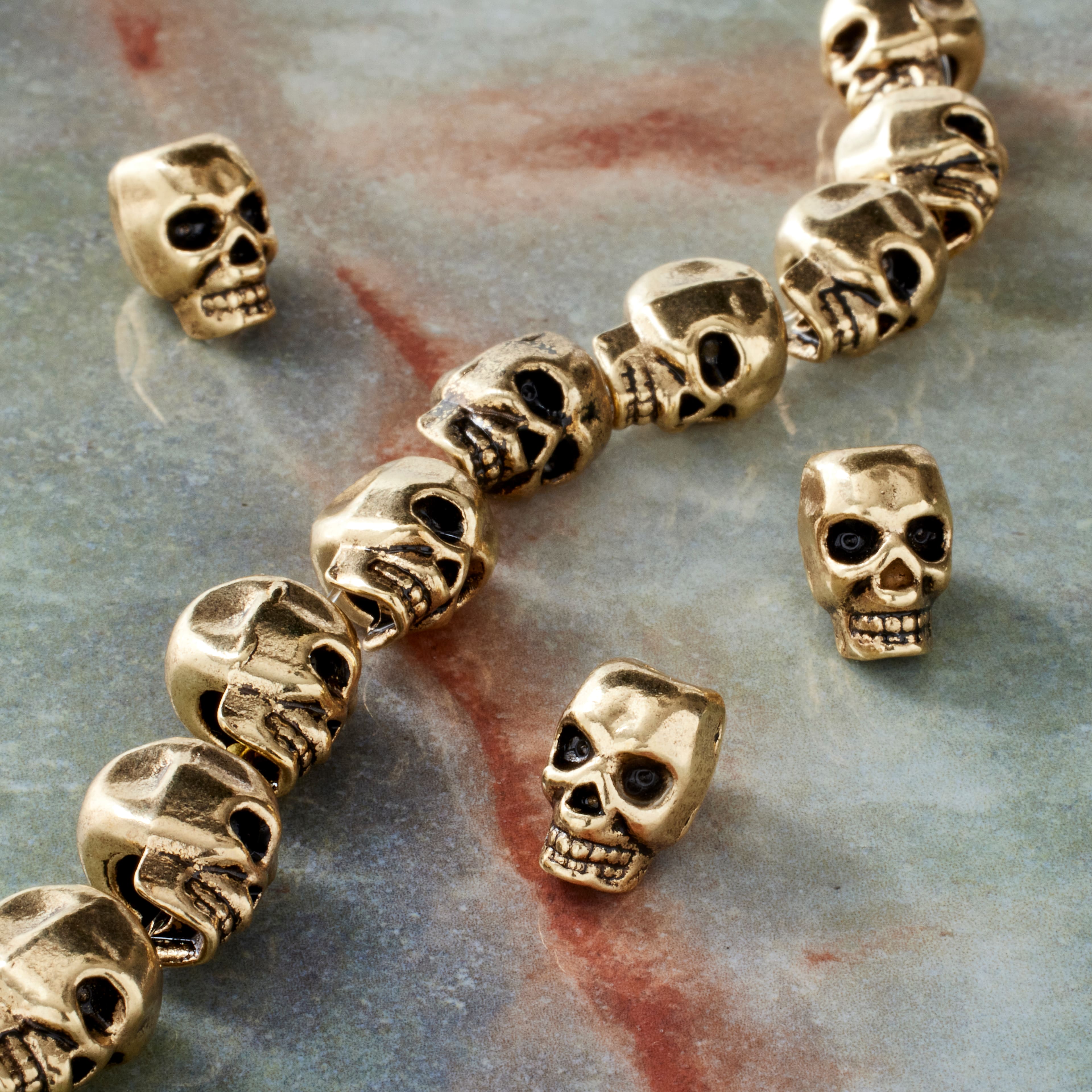 12 Packs: 12 ct. (144 total) Antique Gold Metal Skull Beads, 12mm by Bead Landing™