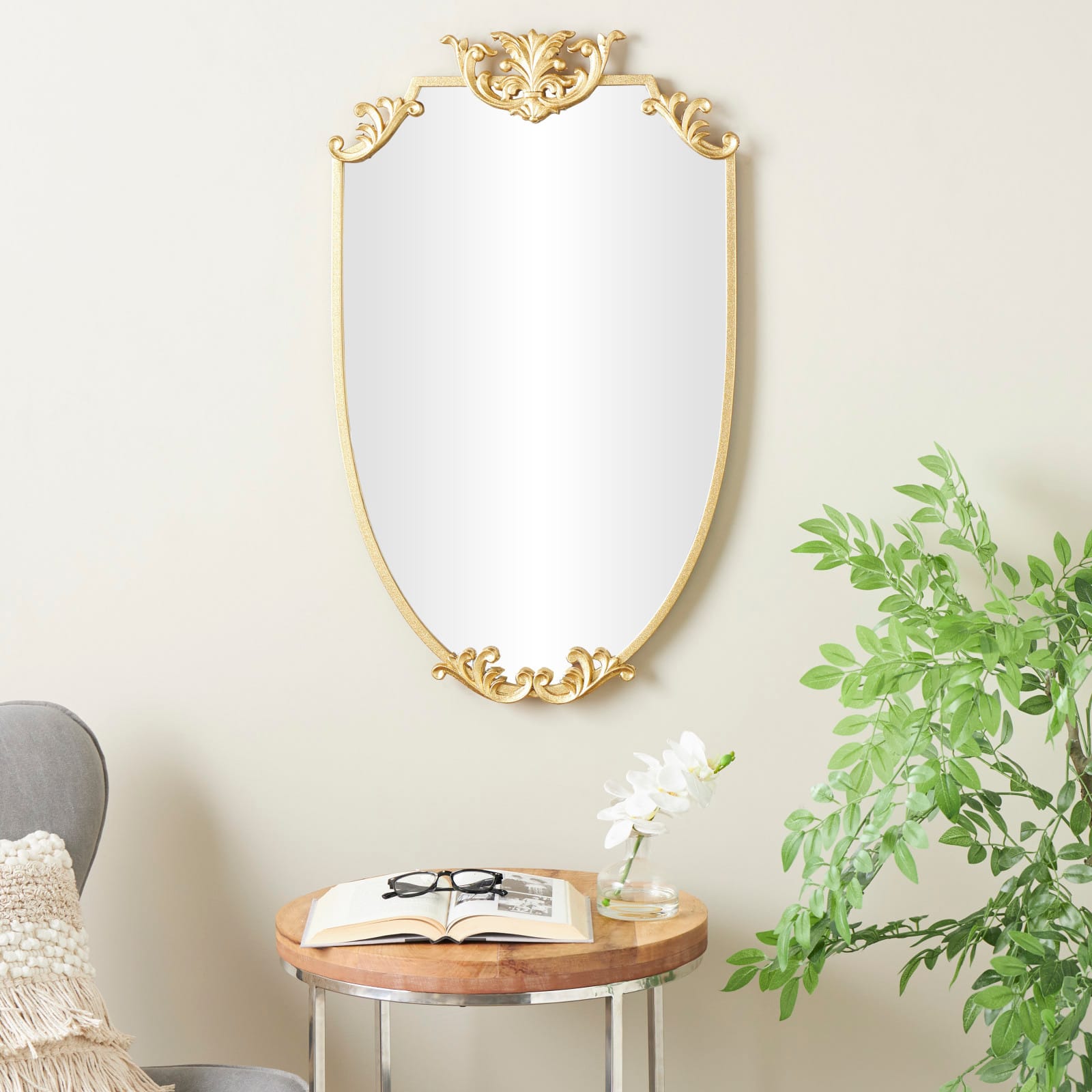 21" x 34" Gold Metal Shield Wall Mirror with Floral Embellishment