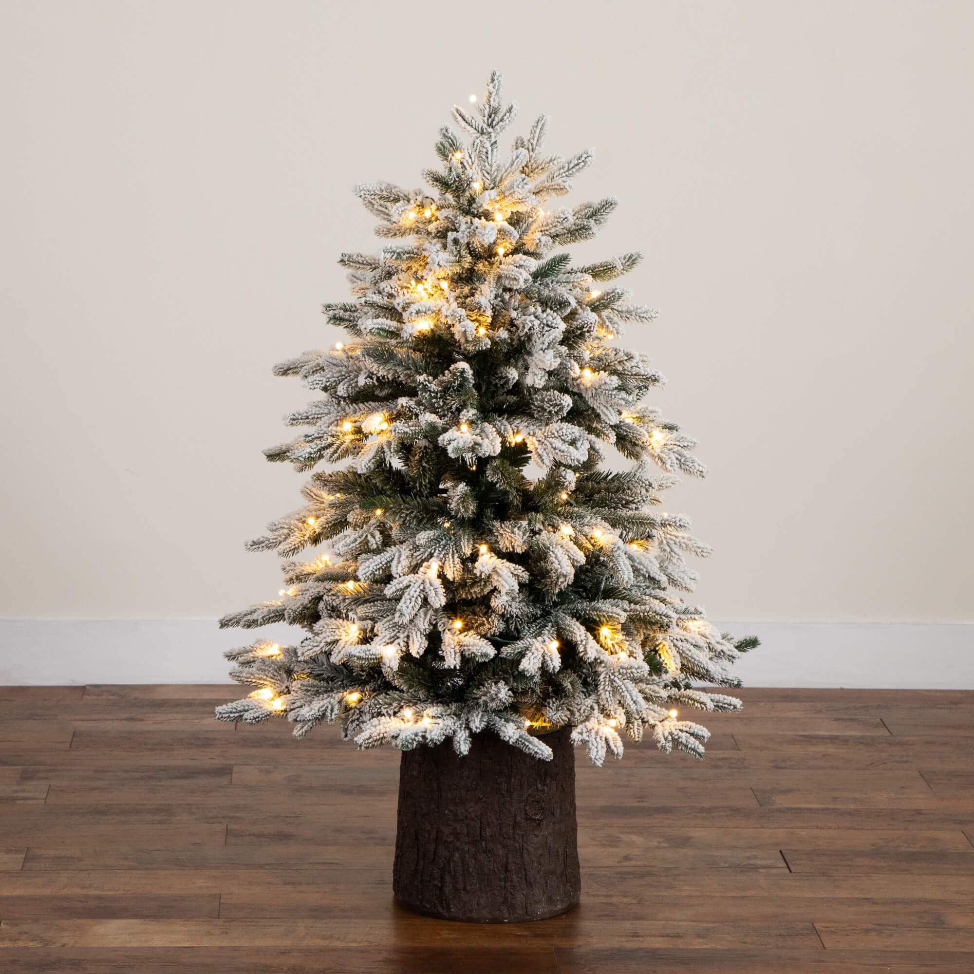 4ft. Pre-Lit Flocked Artificial Christmas Tree in Black Decorative Planter, Warm White LED Lights