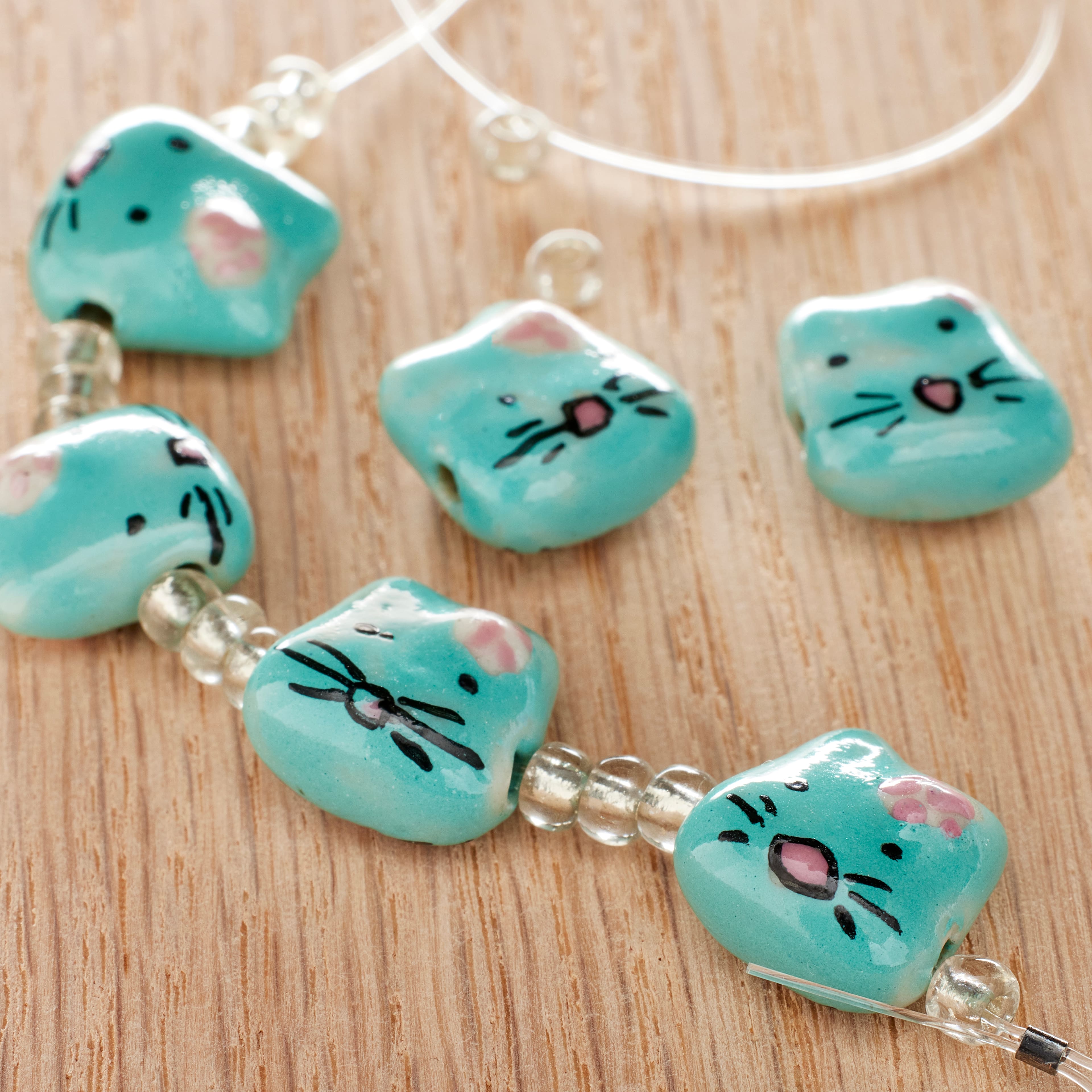 12 Pack: Aqua & Pink Cat Ceramic Beads, 15mm by Bead Landing™