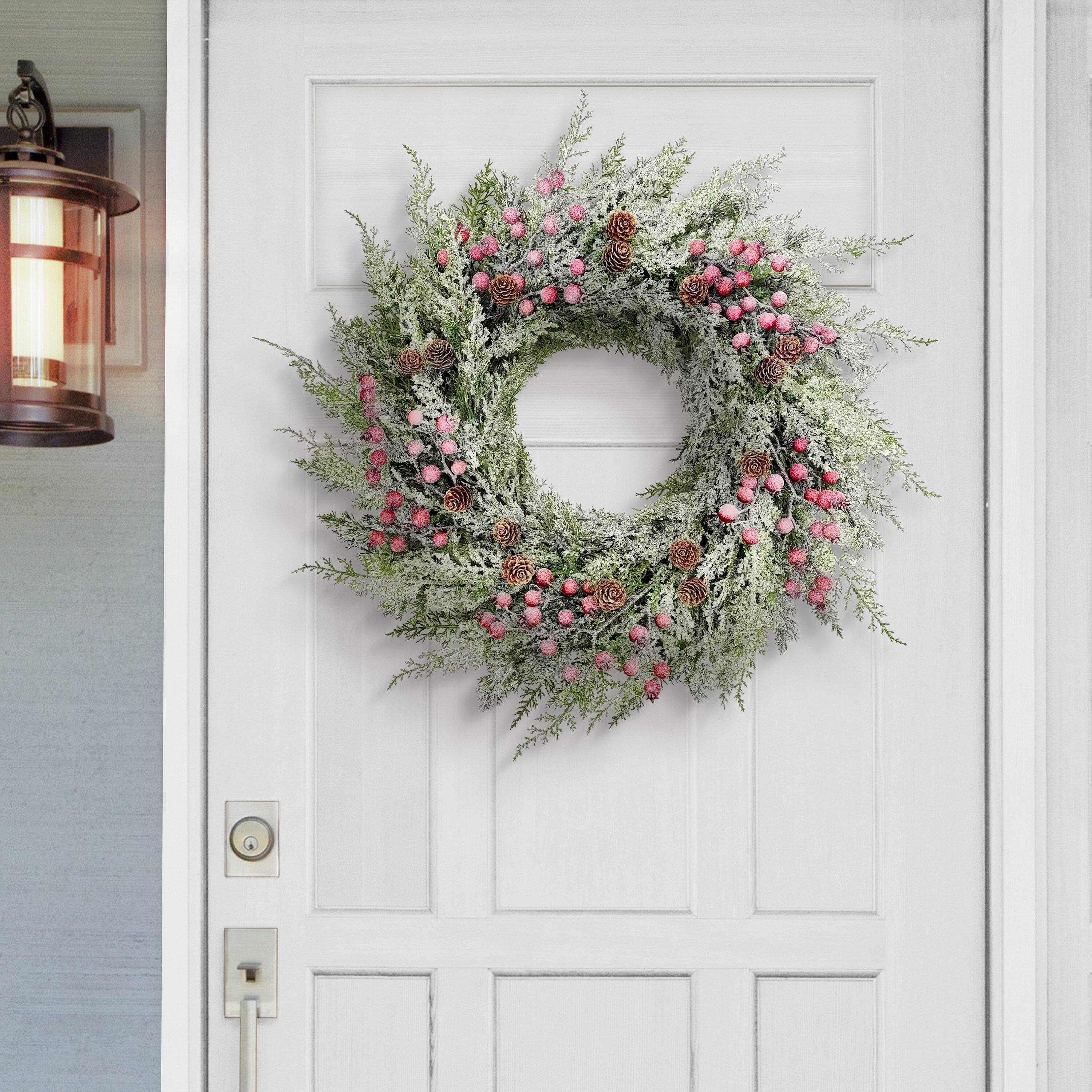 24" Flocked Green Adorned Artificial Wreath with Pinecones & Red Berries