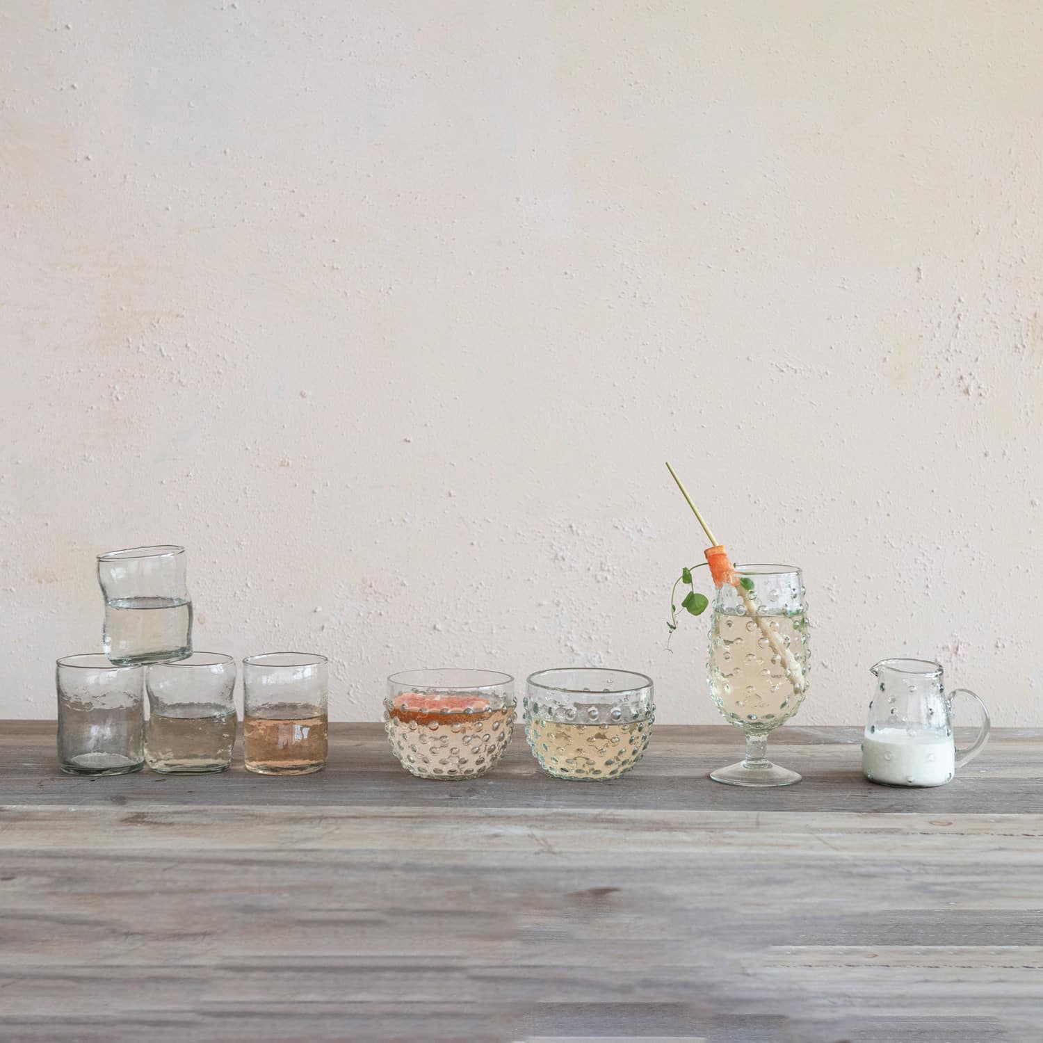 Hello Honey® 7oz. Clear Organic-Shaped Reclaimed Glass Drinking Glasses, 12ct.