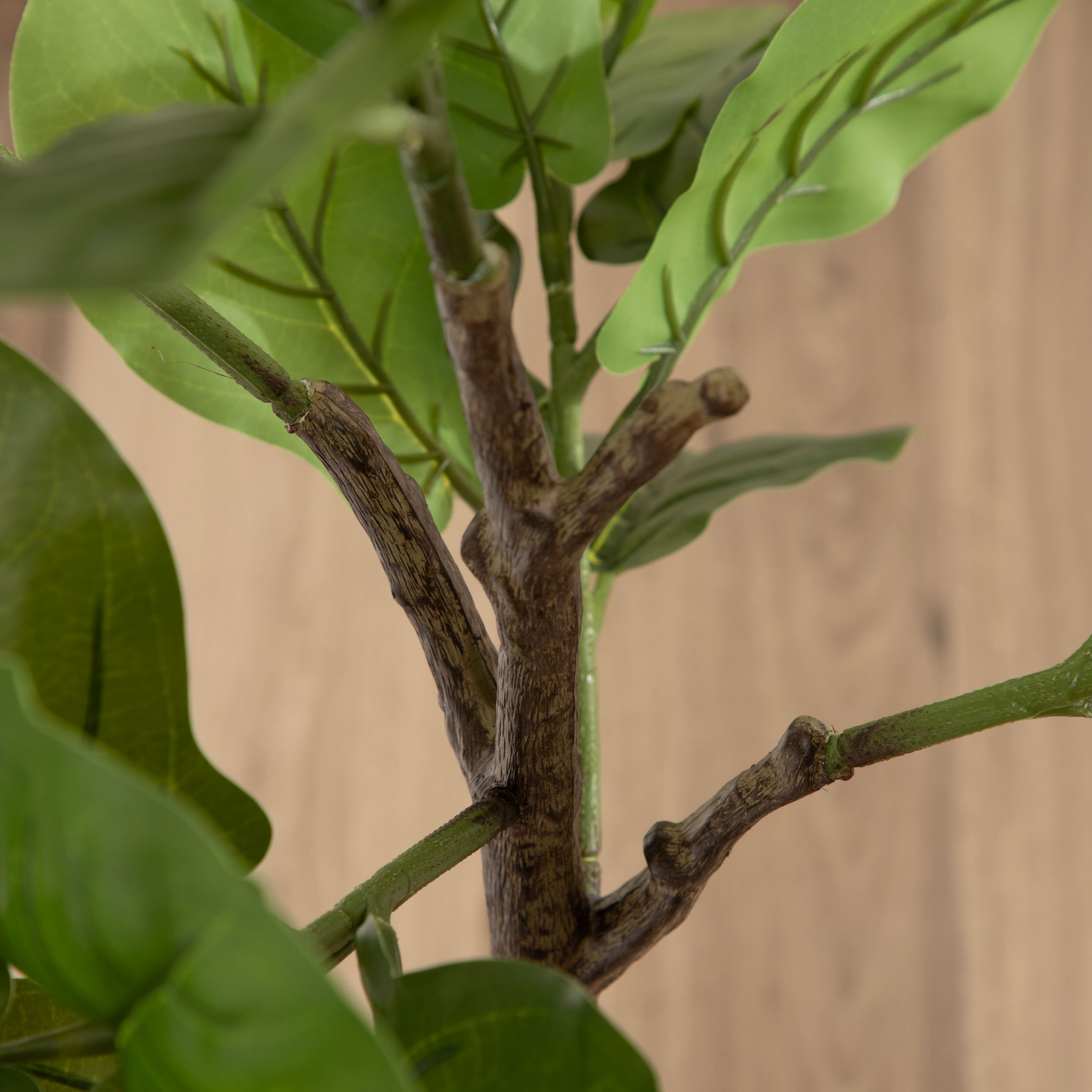 Kate and Laurel 4ft. Fidmont Faux Fiddle Fig Tree in Claudel Scalloped Planter
