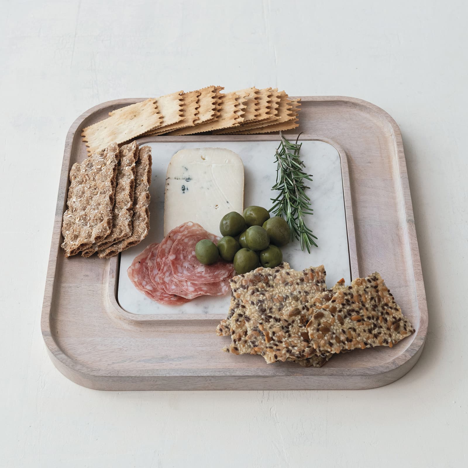 Hello Honey® 13.5" White Marble & Wood Cutting Board on a Dish