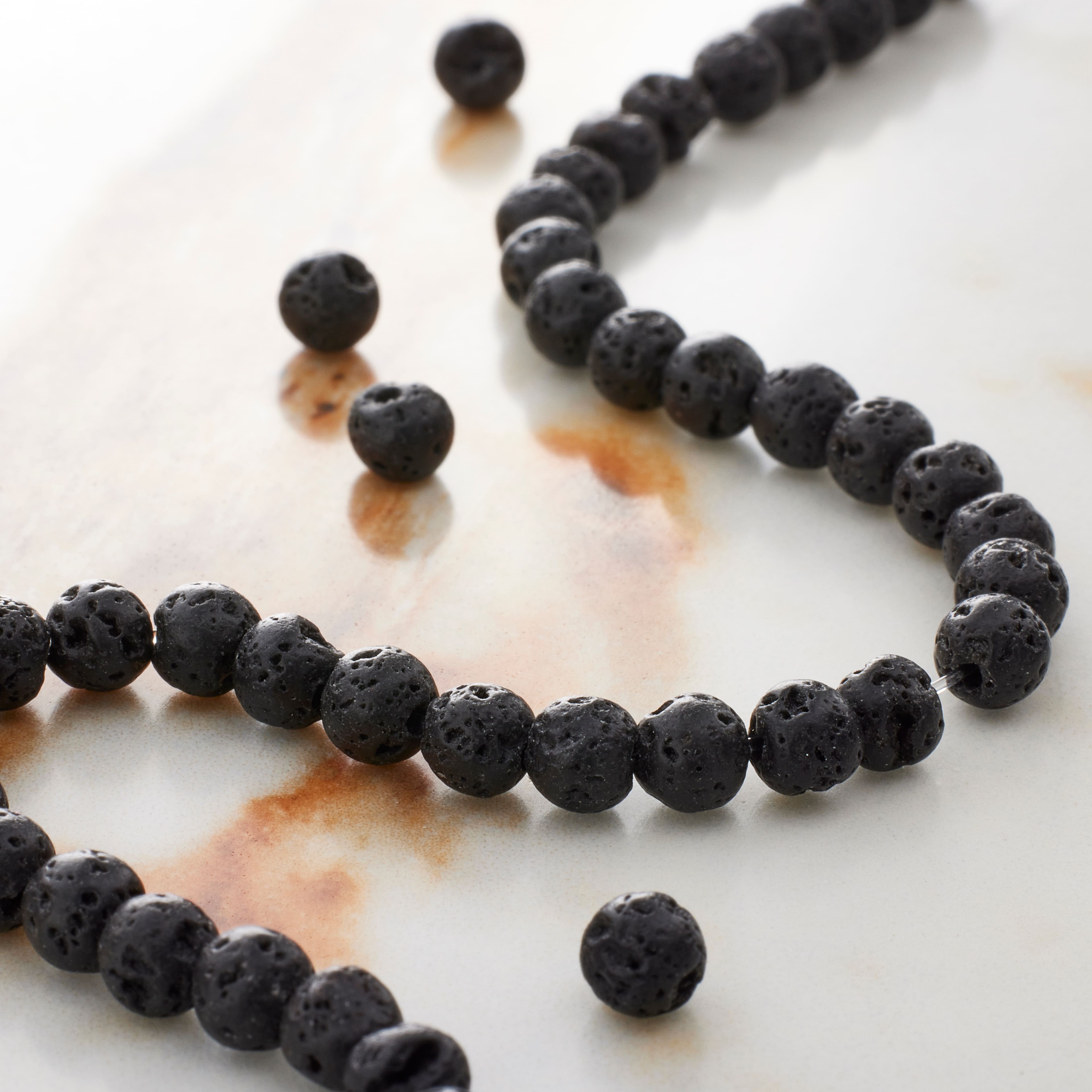 12 Pack: Black Lava Round Beads, 4mm by Bead Landing™