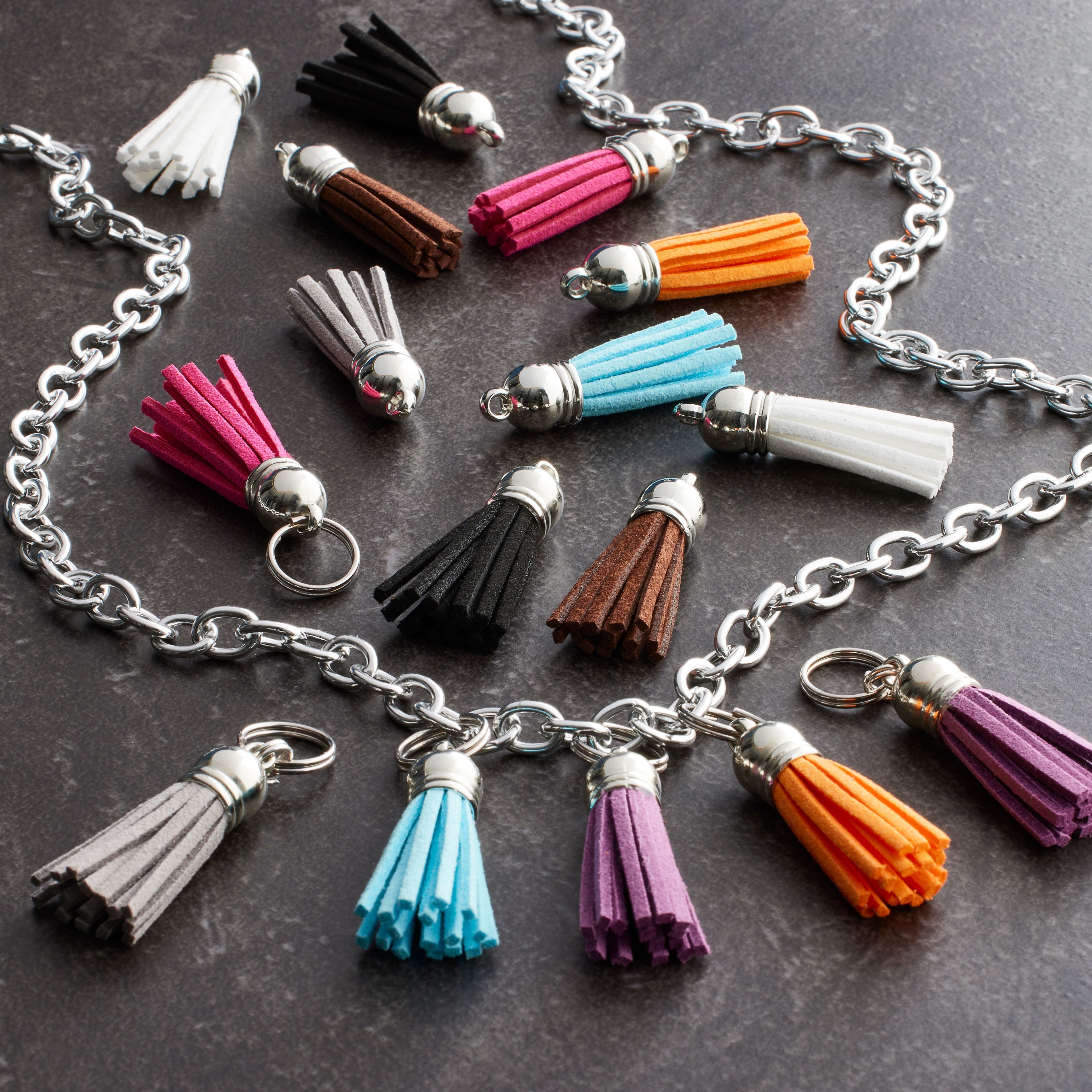 12 Packs: 16 ct. (192 total) Assorted Color Suede Tassels by Bead Landing™