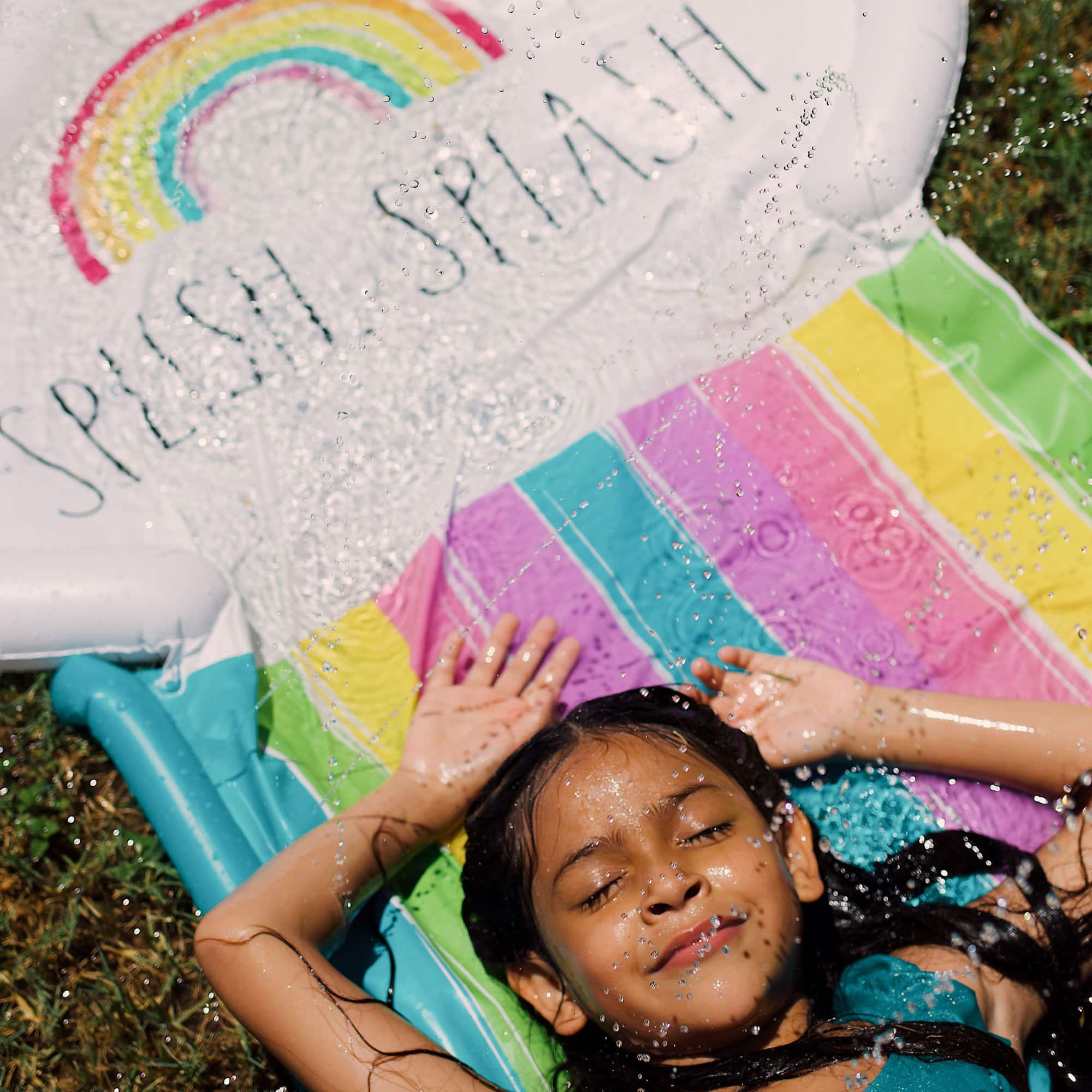 Rae Dunn 16ft. Splish Splash Rainbow Slide & Ride with Sprinkler