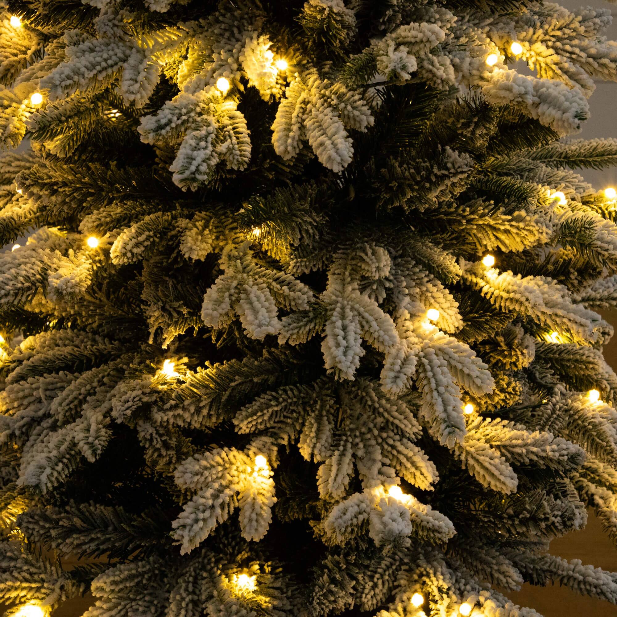 4ft. Pre-Lit Flocked Artificial Christmas Tree in Black Decorative Planter, Warm White LED Lights
