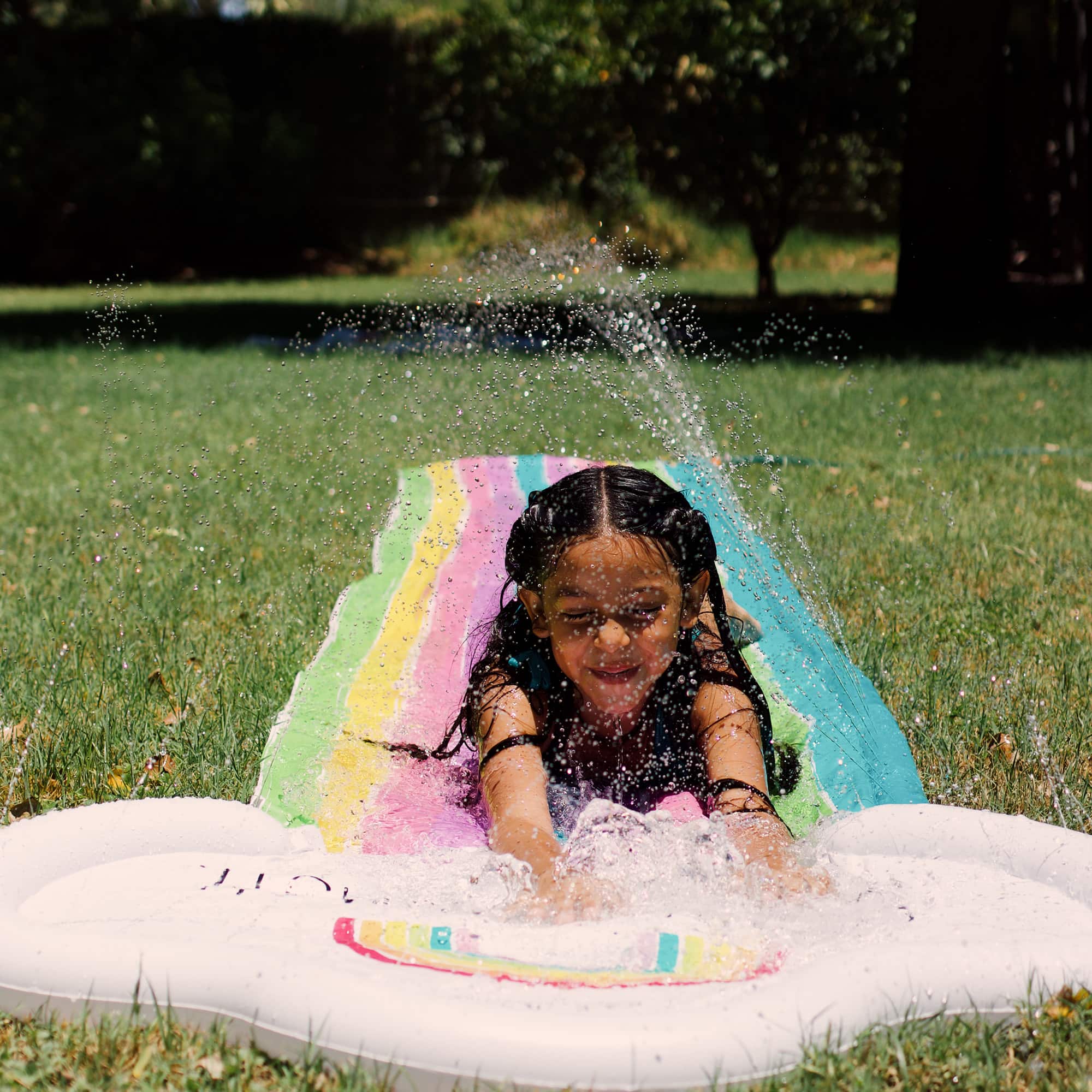 Rae Dunn 16ft. Splish Splash Rainbow Slide & Ride with Sprinkler