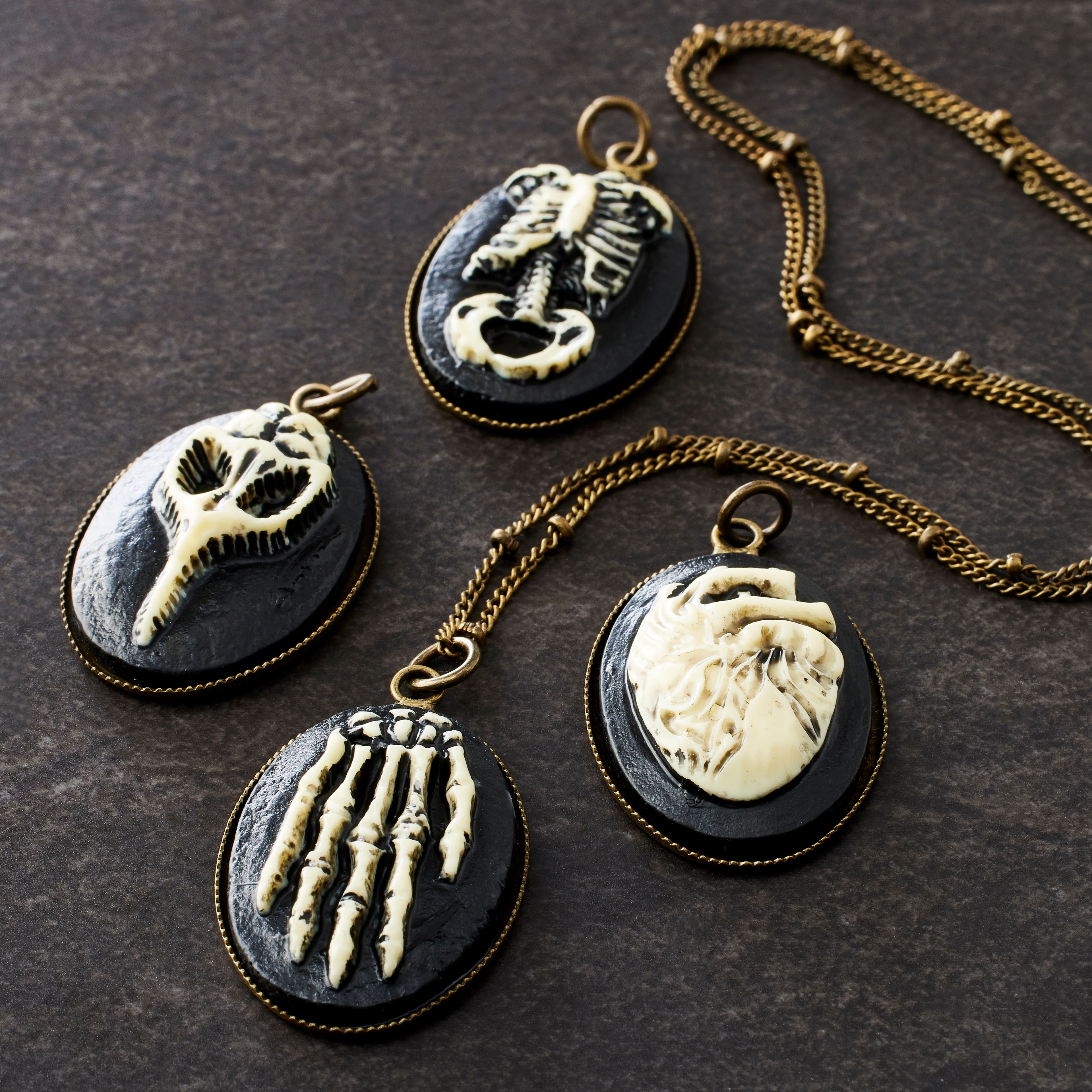 12 Packs: 4 ct. (48 total) Found Objects™ Anatomy Resin Charms by Bead Landing™