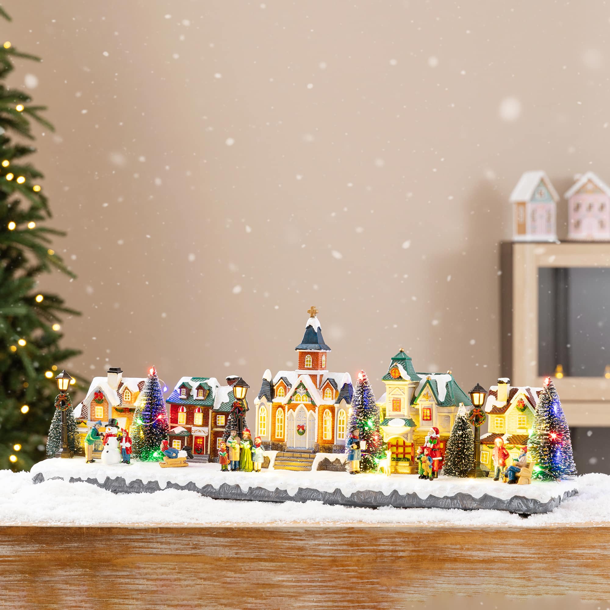 Glitzhome® 22" Lighted Christmas Santa Musical Resin Village with Timer