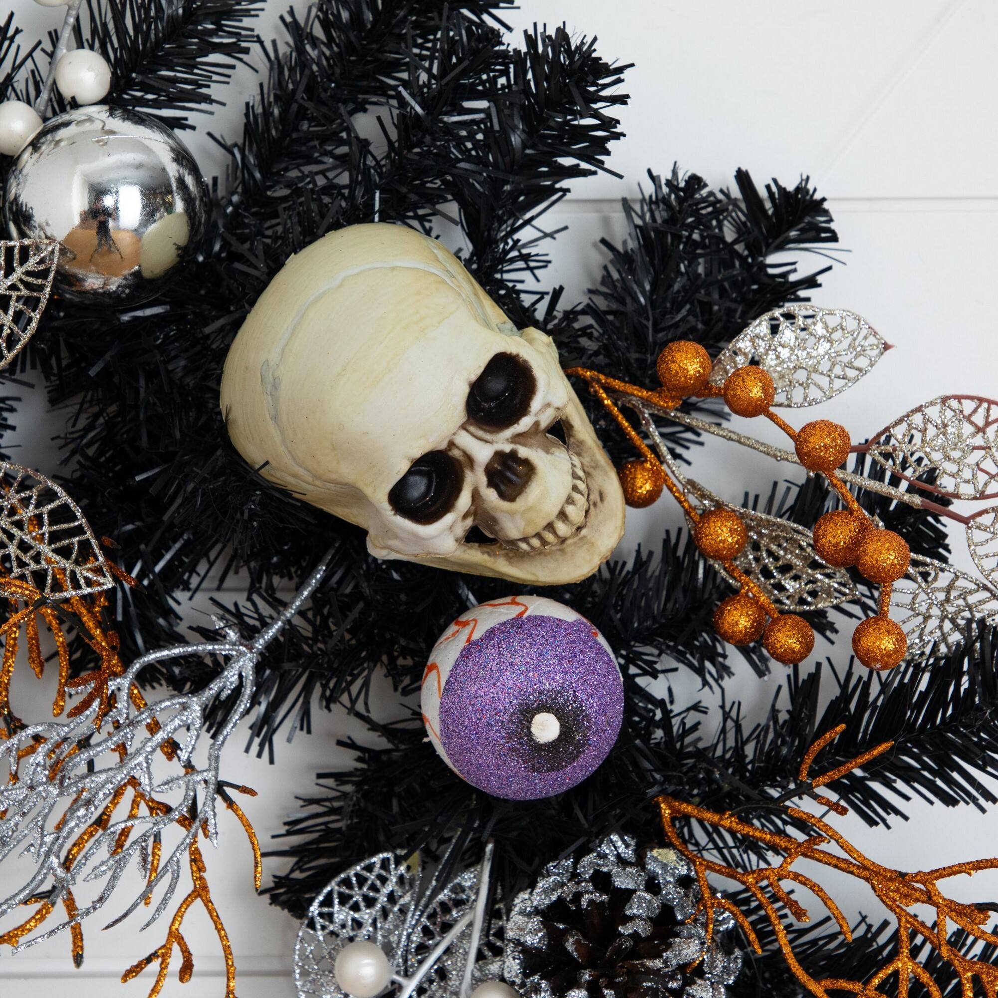 6ft. Artificial Halloween Black Garland with Skulls, Eyeballs & Spiders
