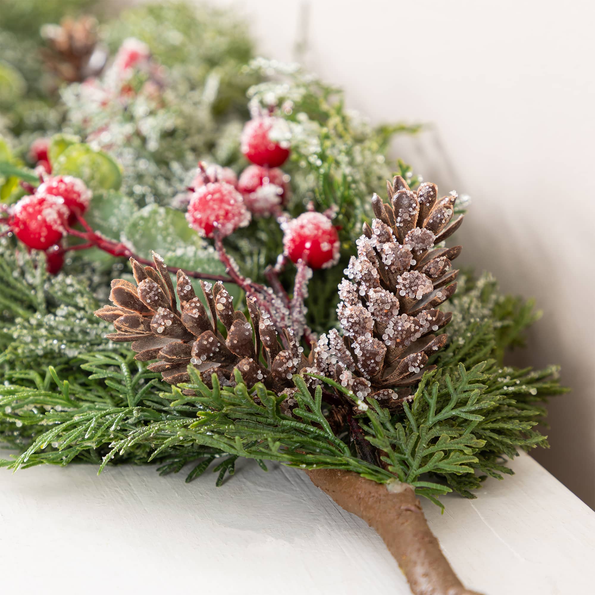 Glitzhome® 6ft. Christmas Greenery Frosted PE Dripping Garland with Pinecones & Red Berries, Set of 2