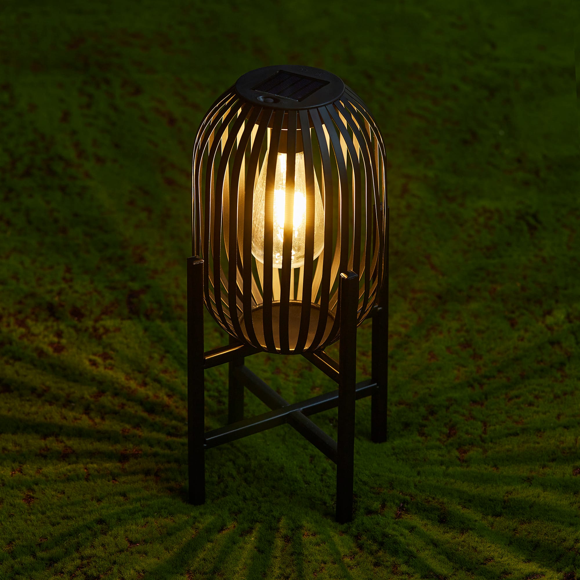 Glitzhome® 14.25" Black Slim Metal Stripes Solar Powered Edison Bulb Outdoor Lantern