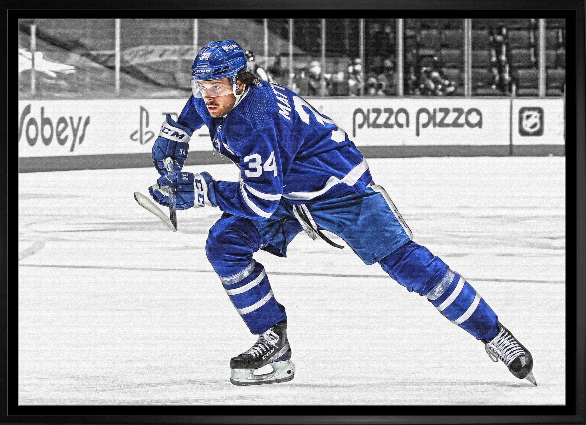 Auston Matthews Toronto Maple Leafs Framed 20" x 29" Hustling Spotlight Canvas 31.5" x 22.5"