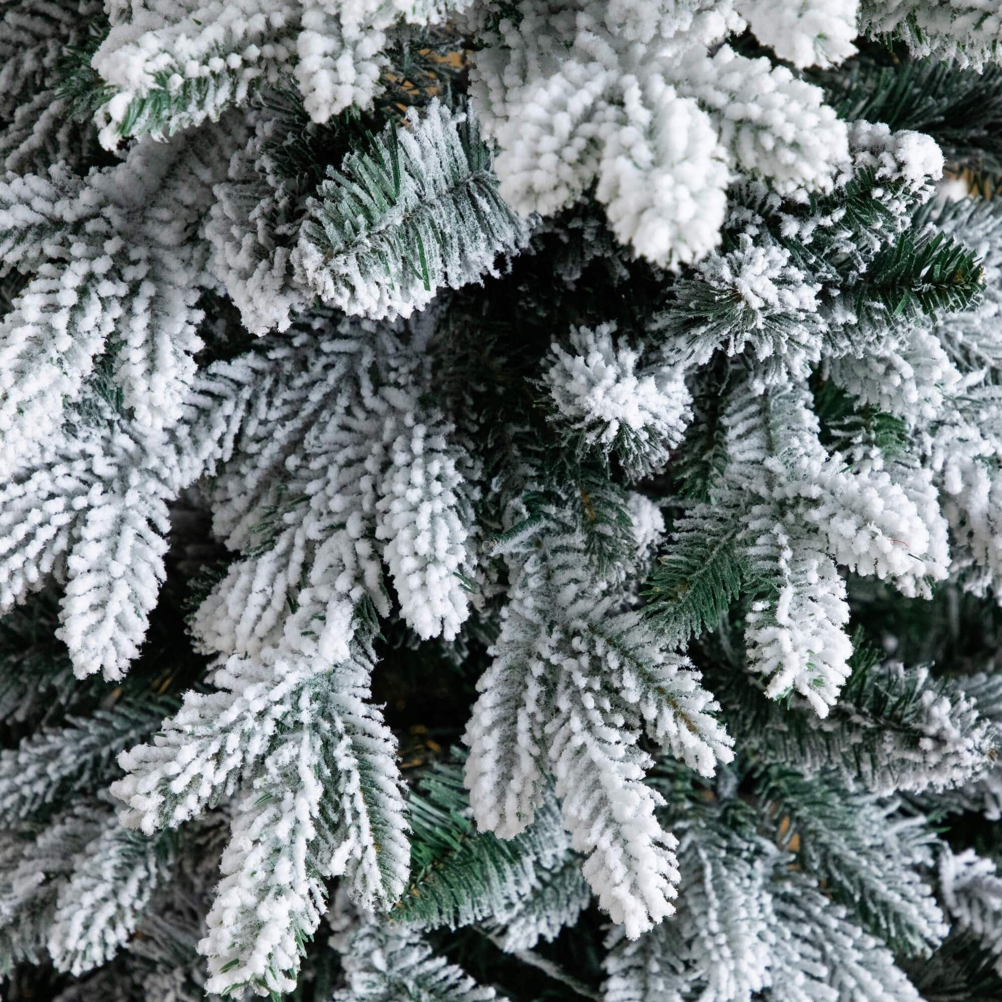 4ft. Pre-Lit Flocked Artificial Christmas Tree in Black Decorative Planter, Warm White LED Lights
