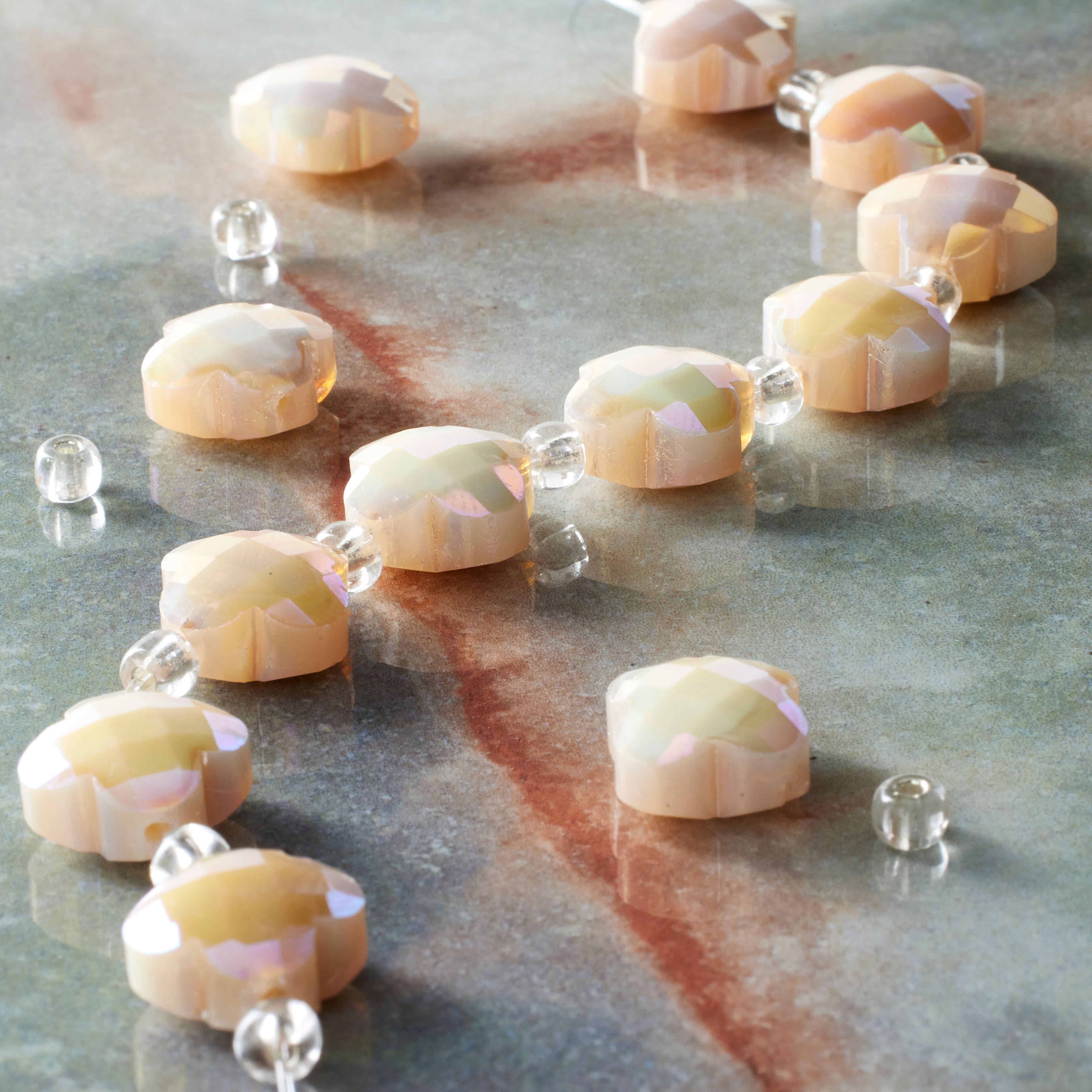 12 Packs: 12 ct. (144 total) Ivory Faceted Glass Cross Beads, 12mm by Bead Landing™
