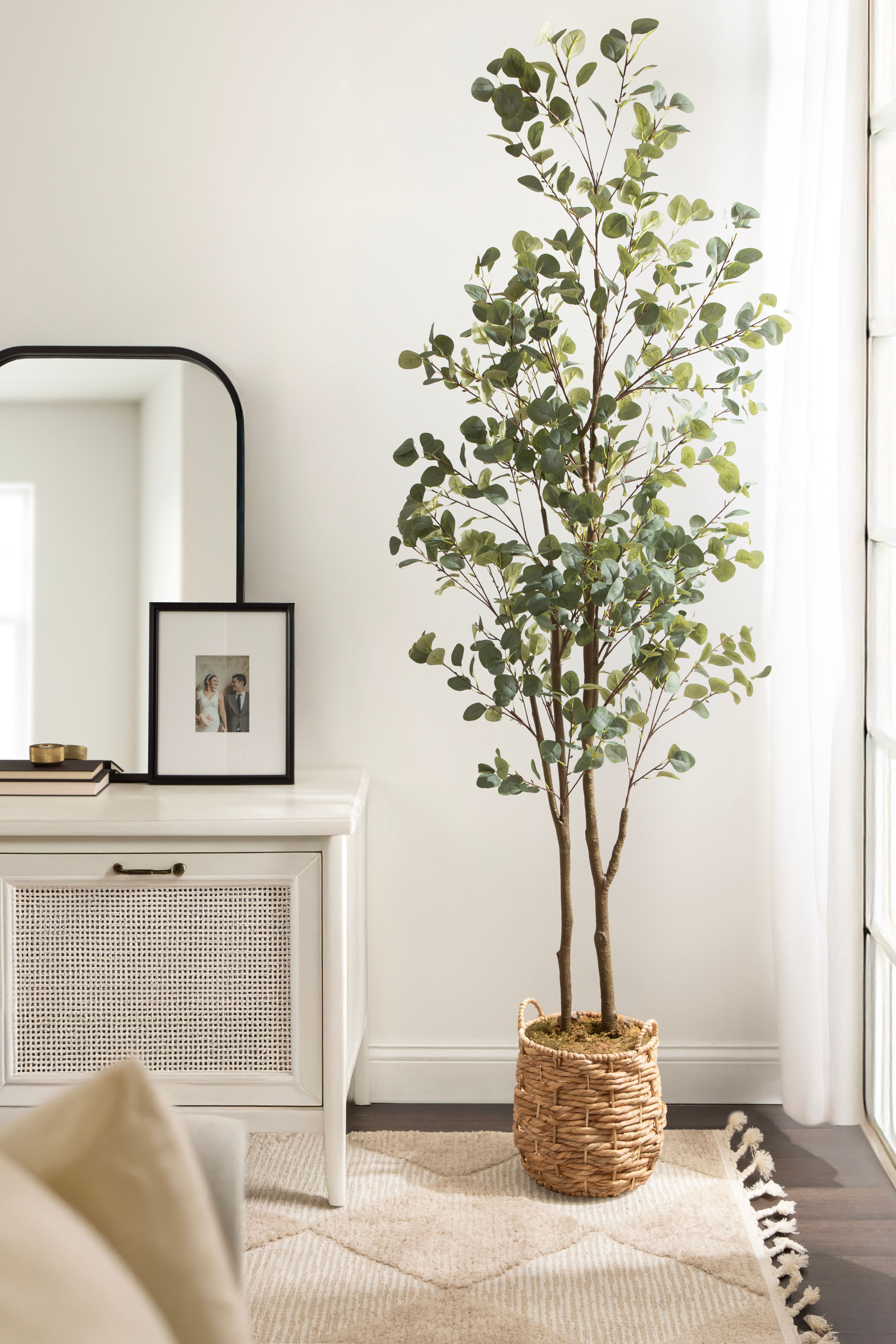 Kate and Laurel 8ft. Eudora Faux Eucalyptus Tree with Natural Planter