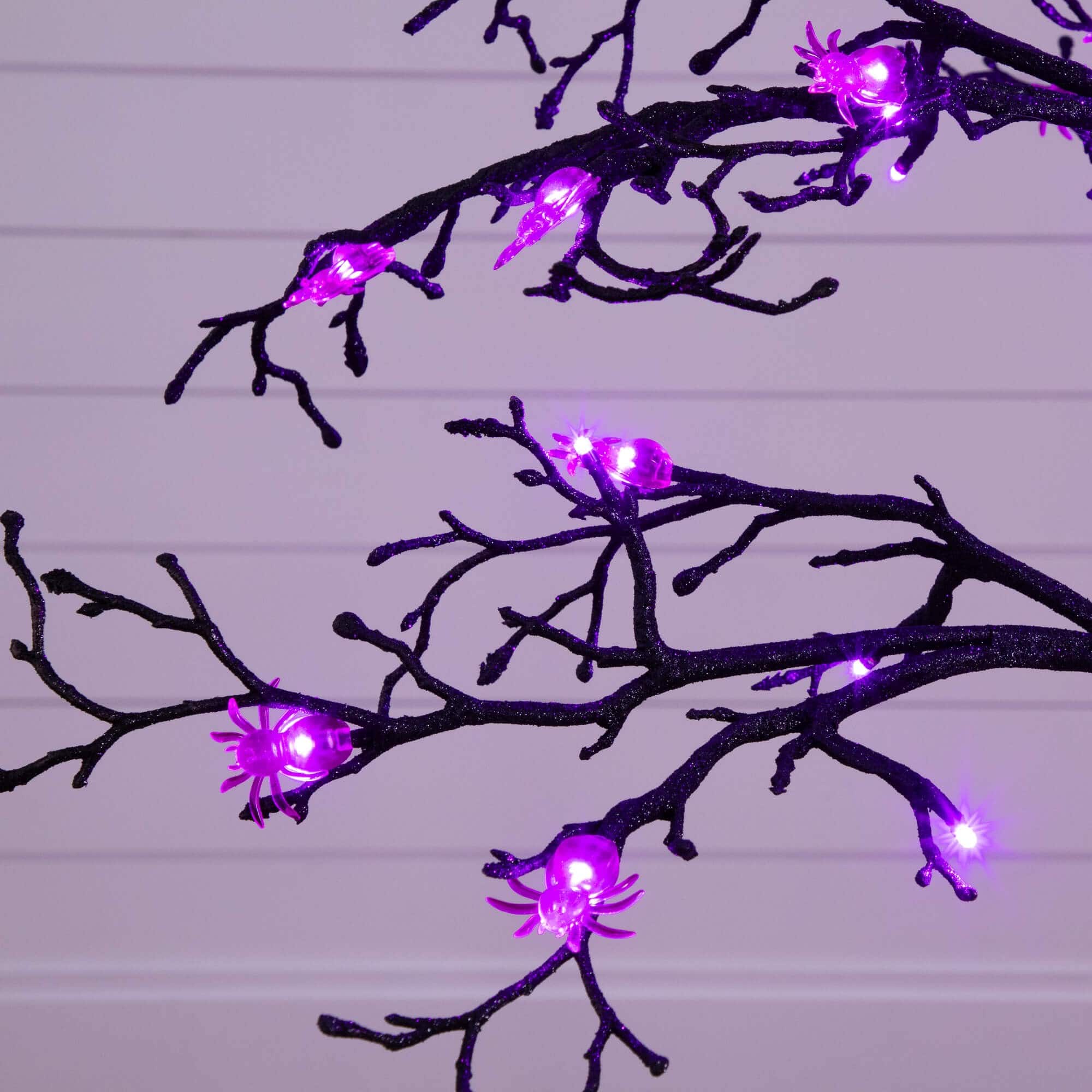 4ft. Pre-Lit Artificial Halloween Spider Twig Tree with 48 Purple LED Lights