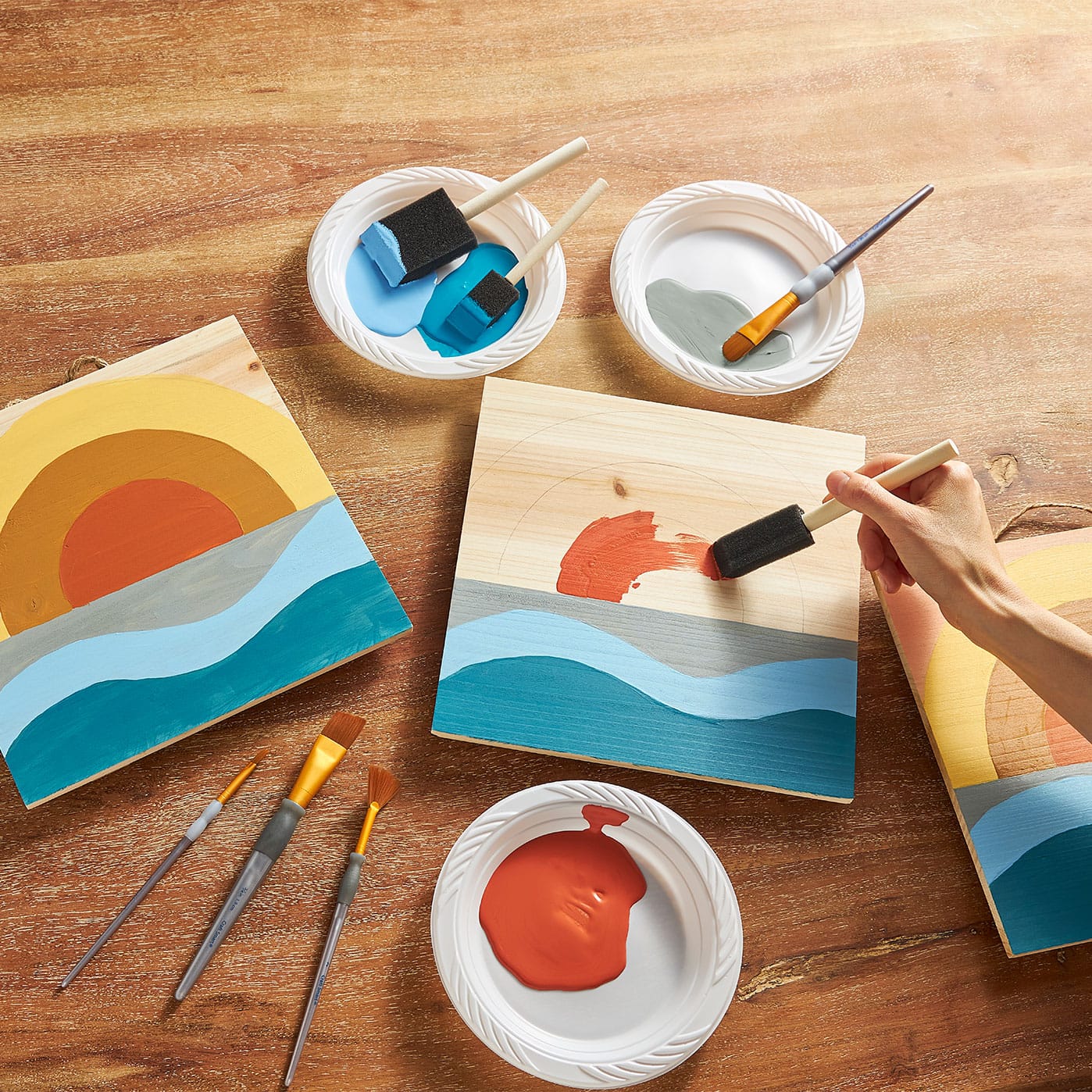 Peinture du lever du soleil sur plaque de bois