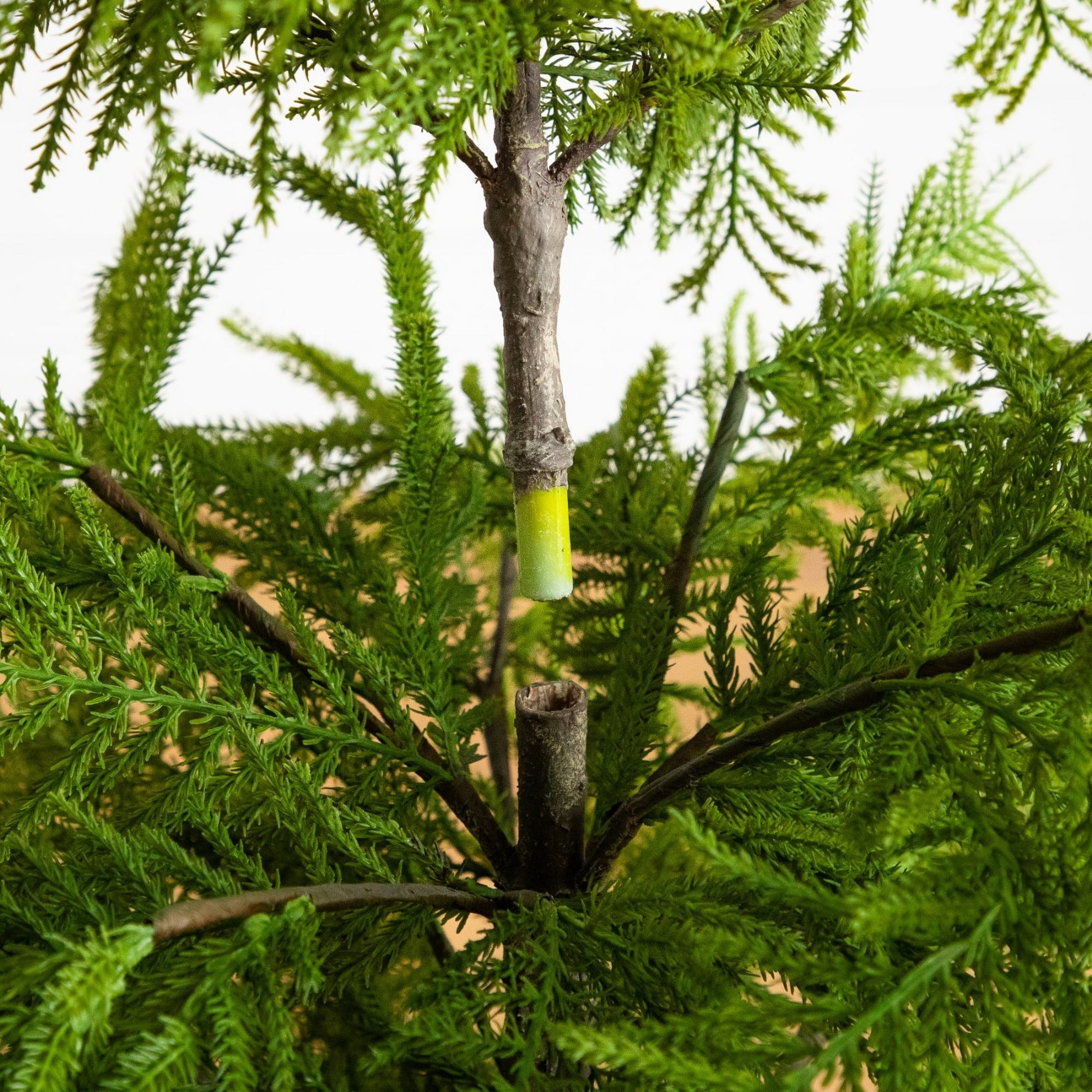 Nearly Natural 4ft. Unlit Artificial Real Touch Goldcrest Christmas Tree in Black Decorative Planter