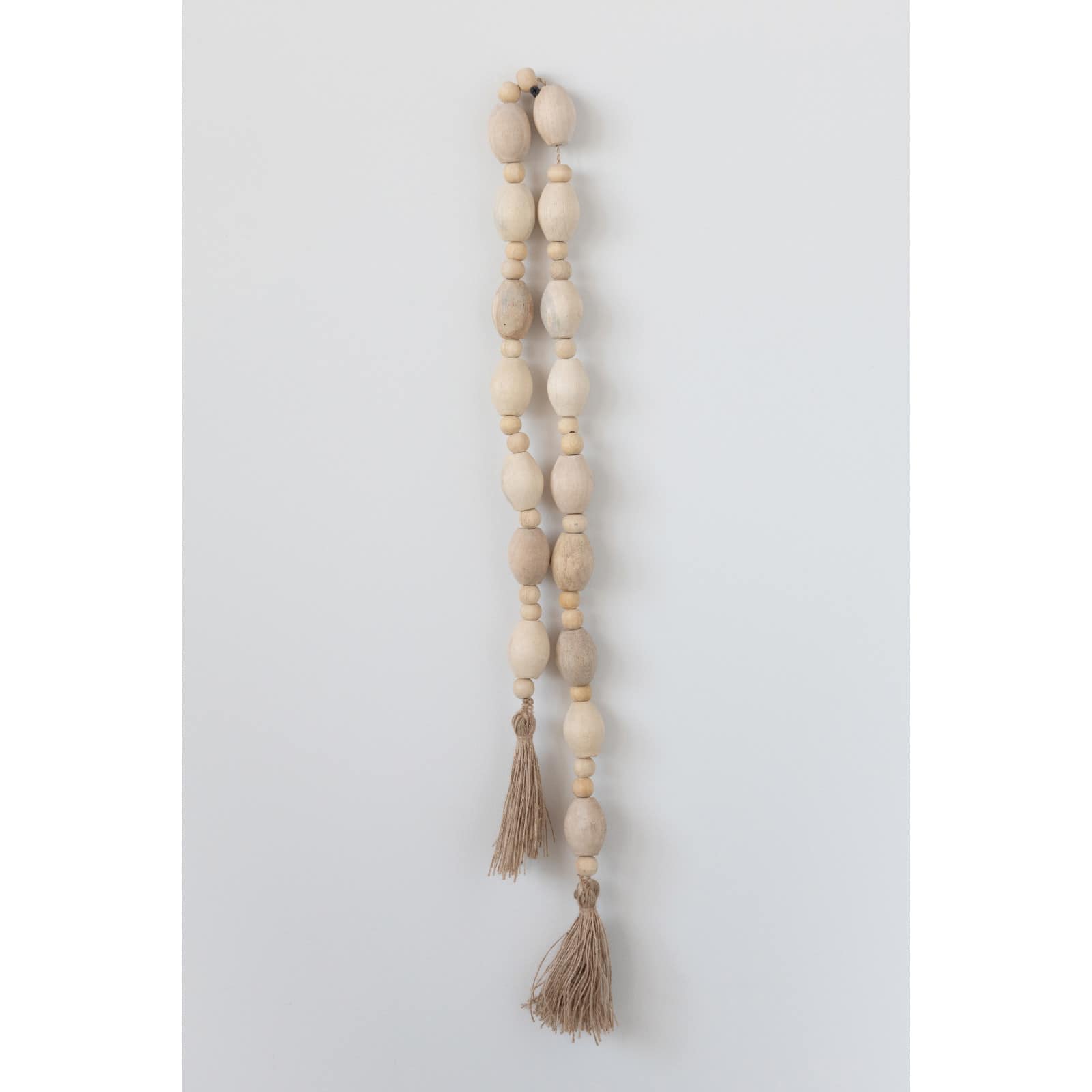 Hello Honey® 60" Mango Wood Bead Garland with Jute Tassels