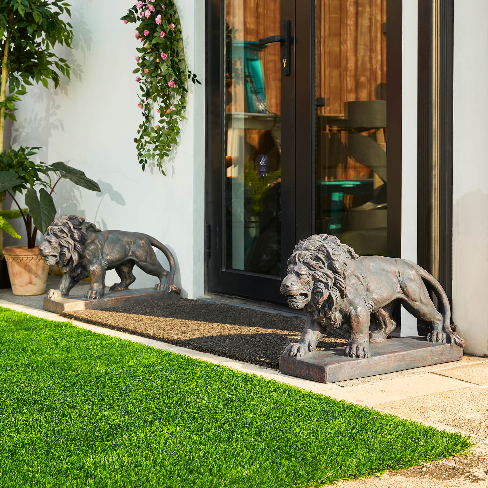 Glitzhome® 24.5" Walking Lion Garden Statue