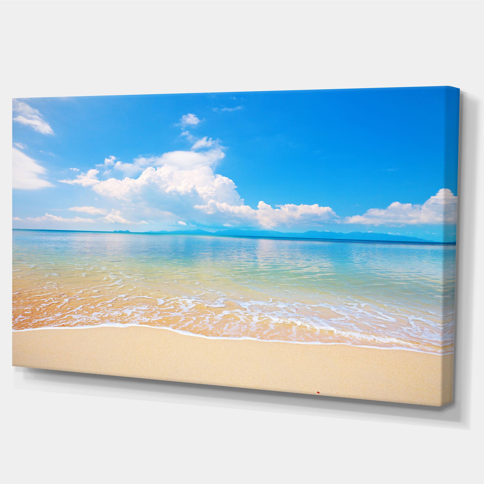 Designart - Large Clouds Over Calm Beach