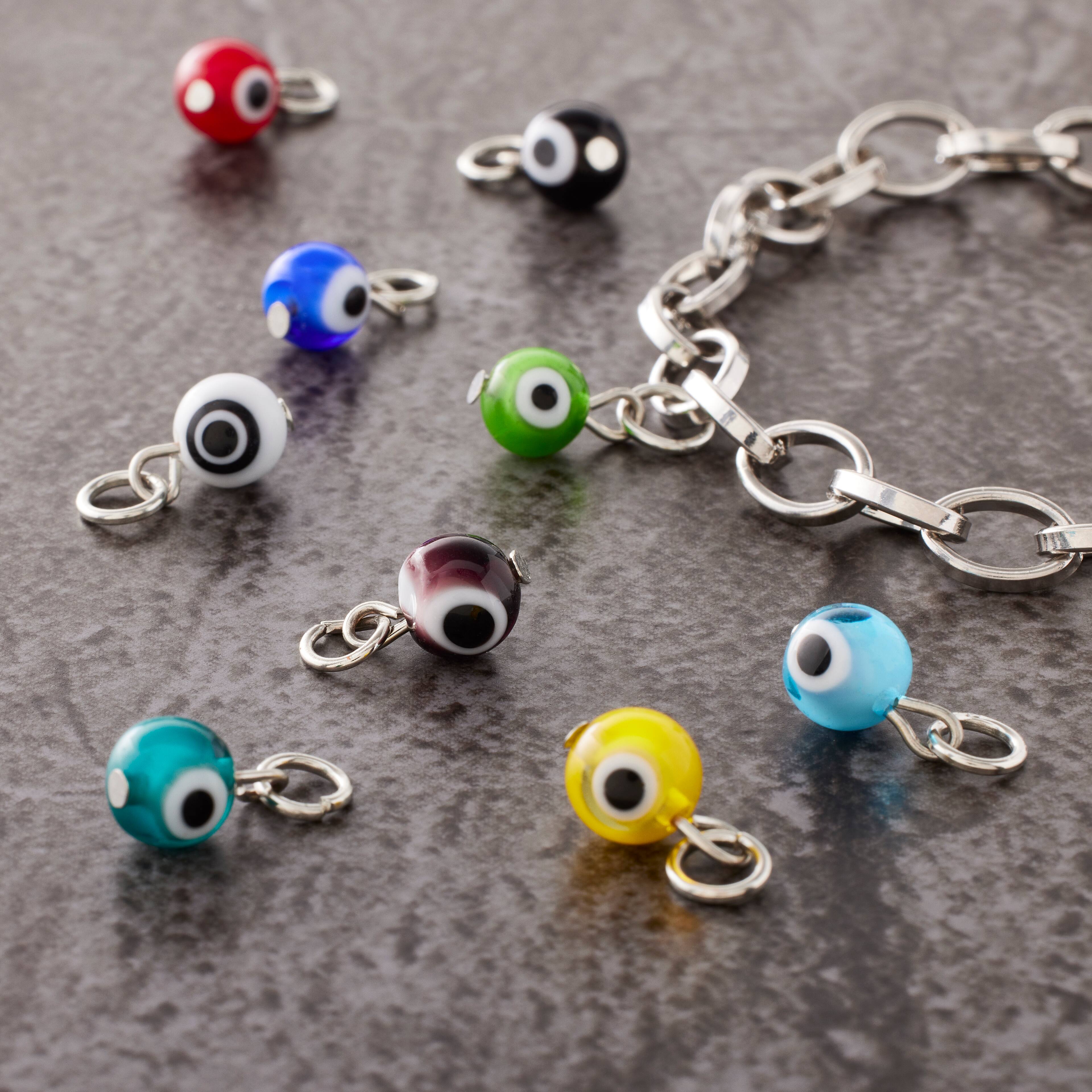 12 Packs: 9 ct. (108 total) Glass Evil Eye Charms by Bead Landing™