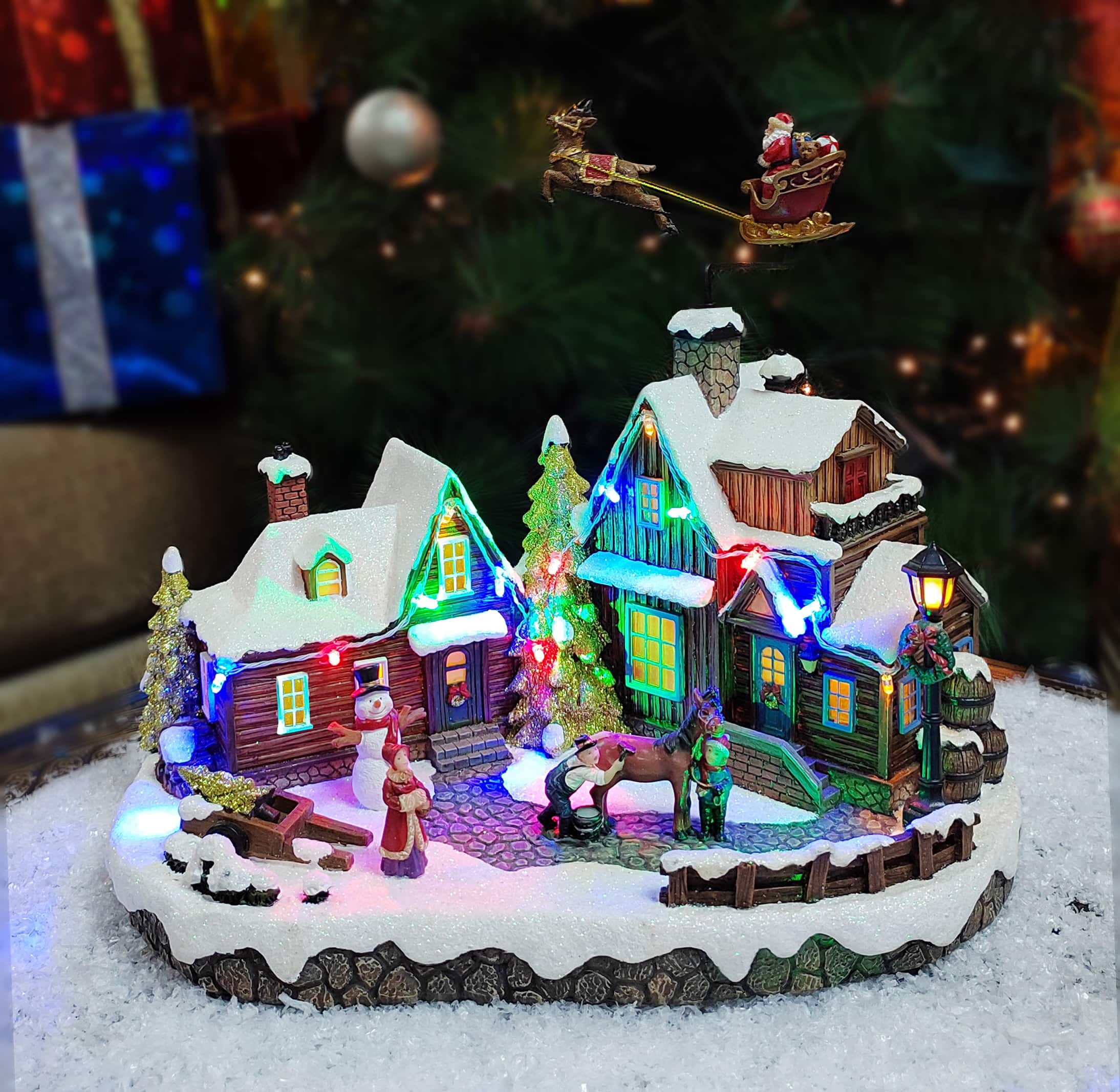 Moments in Time 10.63” Animated Santa with Reindeer Flying Over Homes Décor