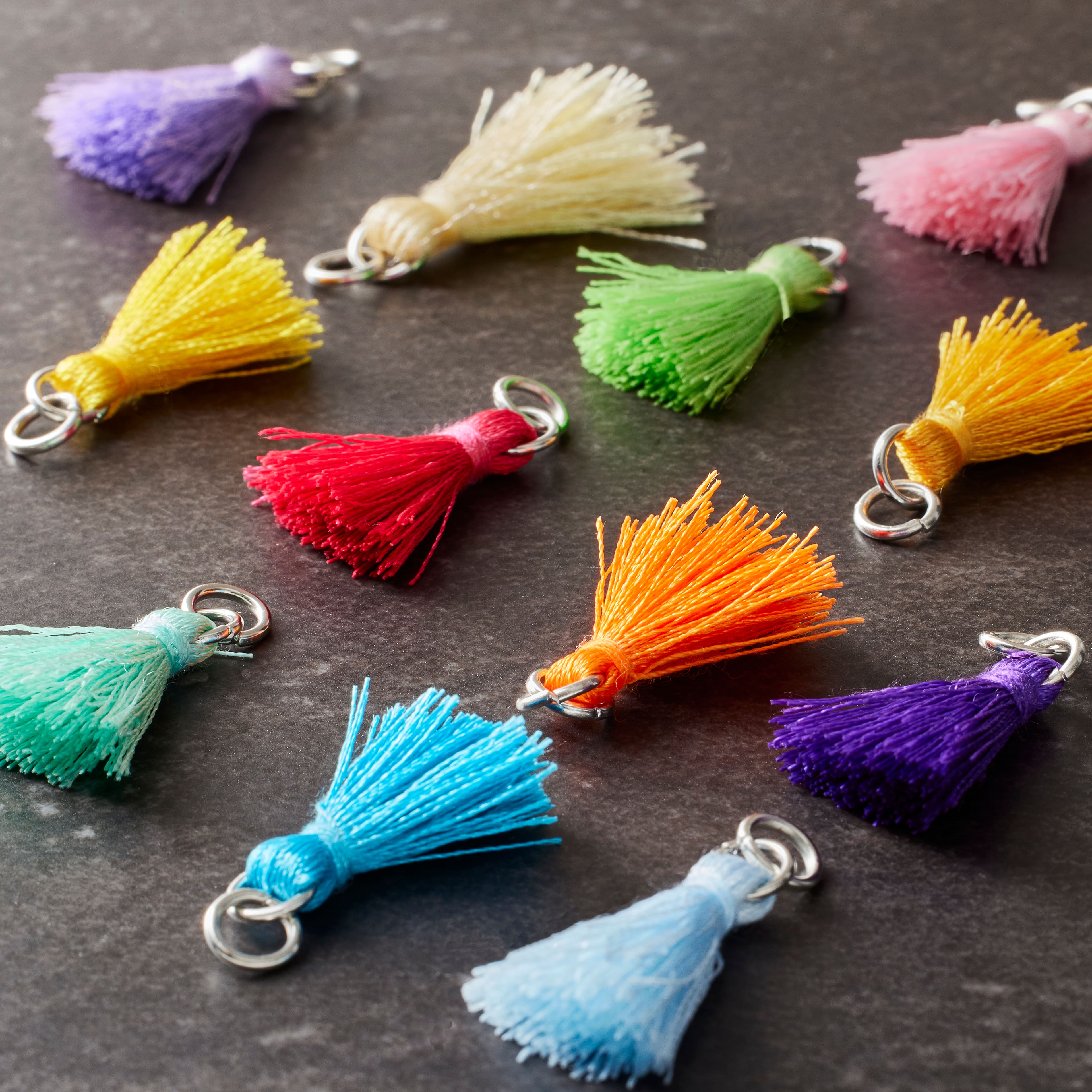 12 Packs: 12 ct. (144 total) Multicolored Tassel Rhodium Charms by Bead Landing™