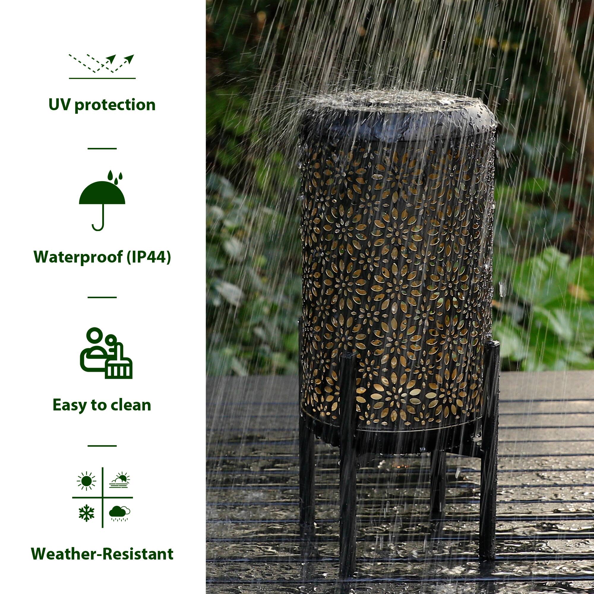 Glitzhome® 14.25" Black Metal Cutout Flower Pattern Solar Powered LED Outdoor Lanterns, 2ct.