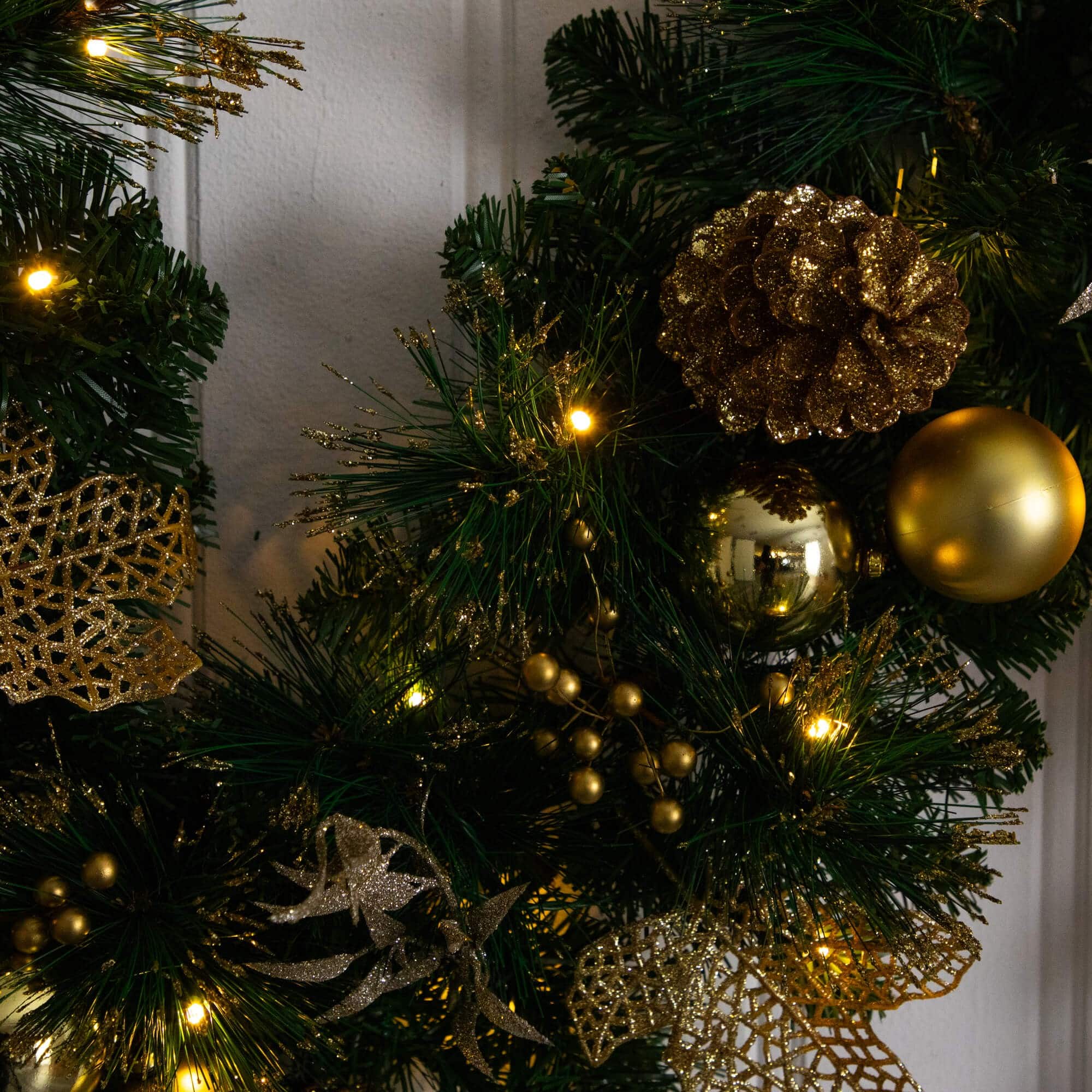 9ft. Pre-Lit Artificial Golden Frosted Christmas Garland with 50 Warm White LED Lights Pinecones, Berries and Ornaments