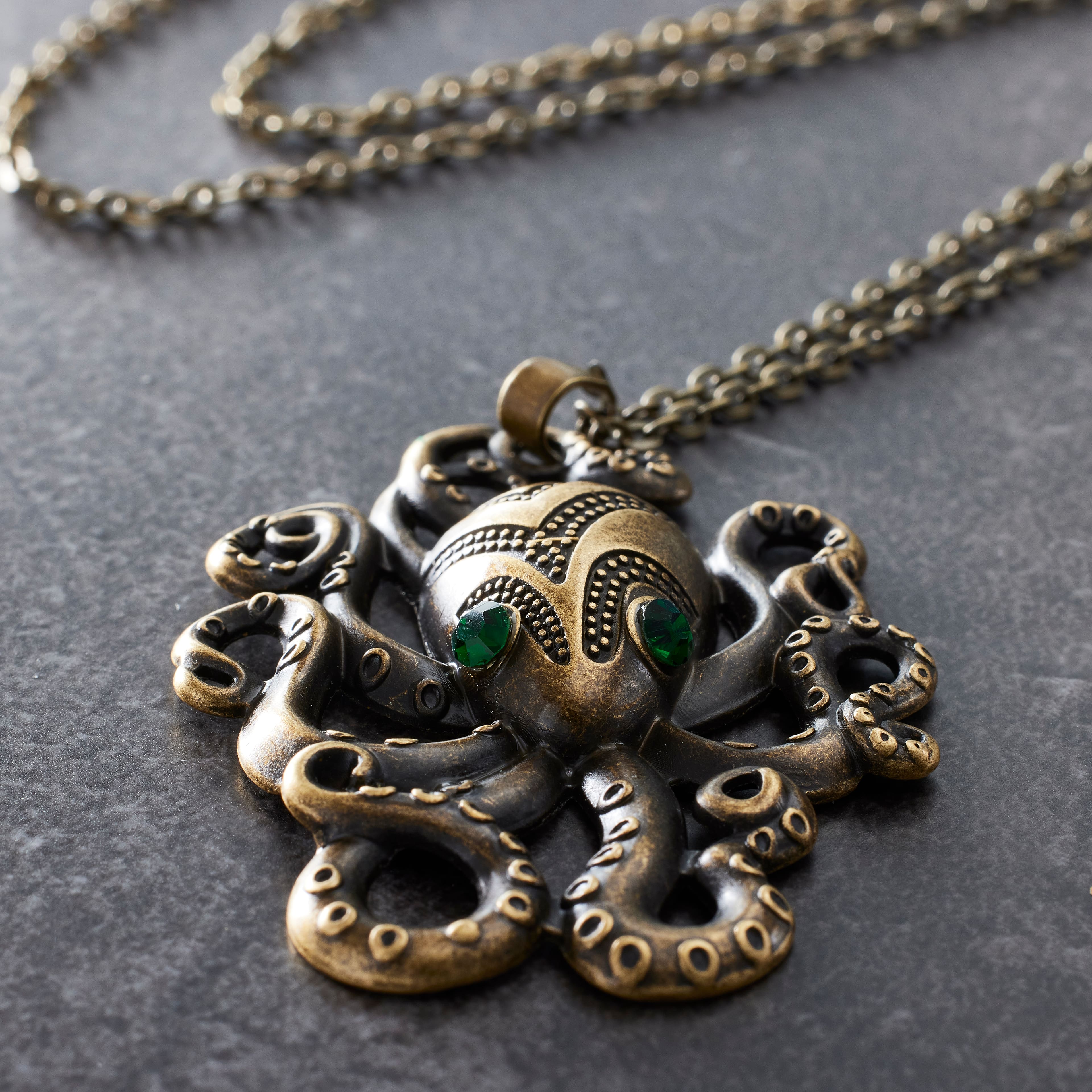12 Pack: Found Objects™ Antique Brass Octopus Pendant by Bead Landing™