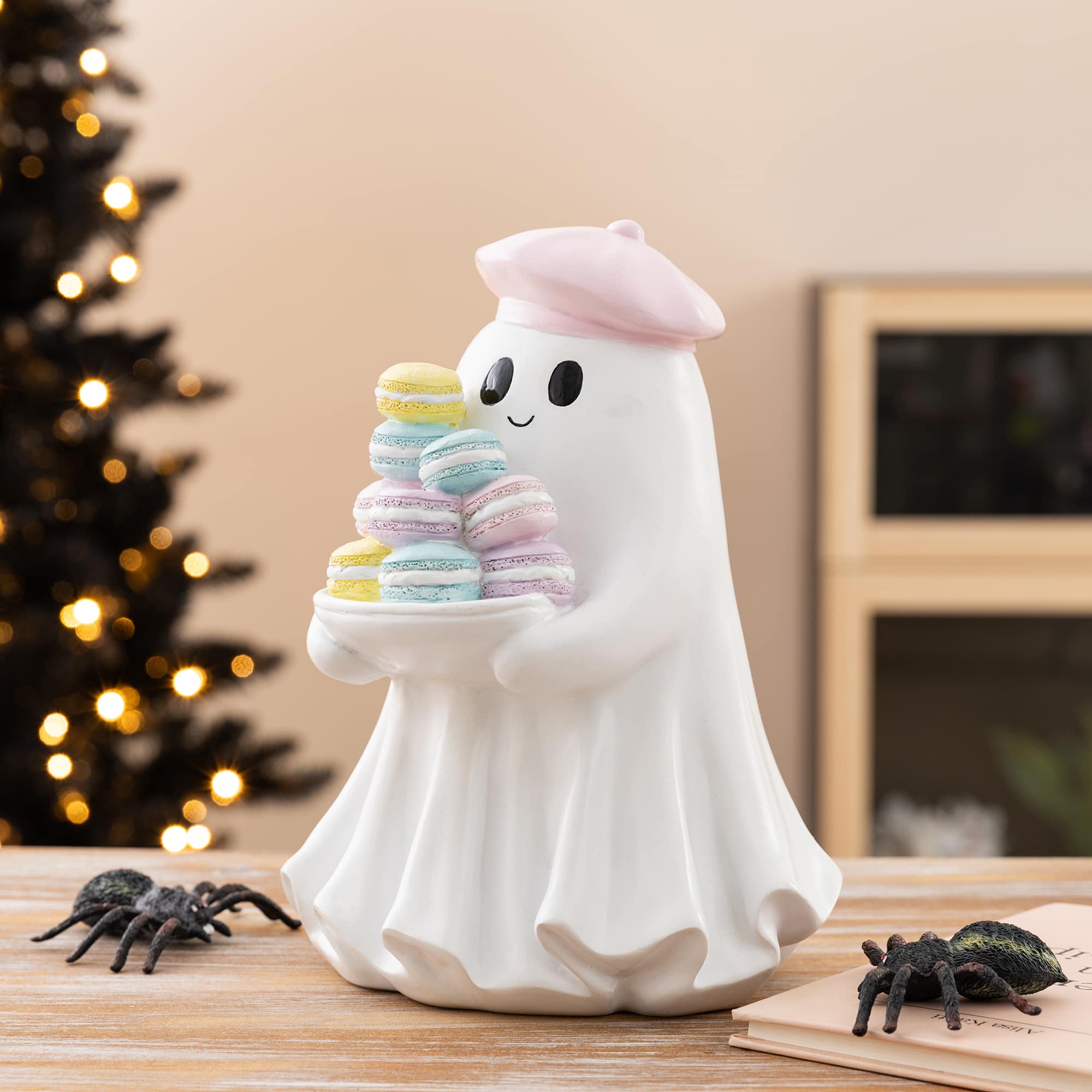 Glitzhome® 9.75" Halloween Polyresin Ghost with Macarons Table Decor