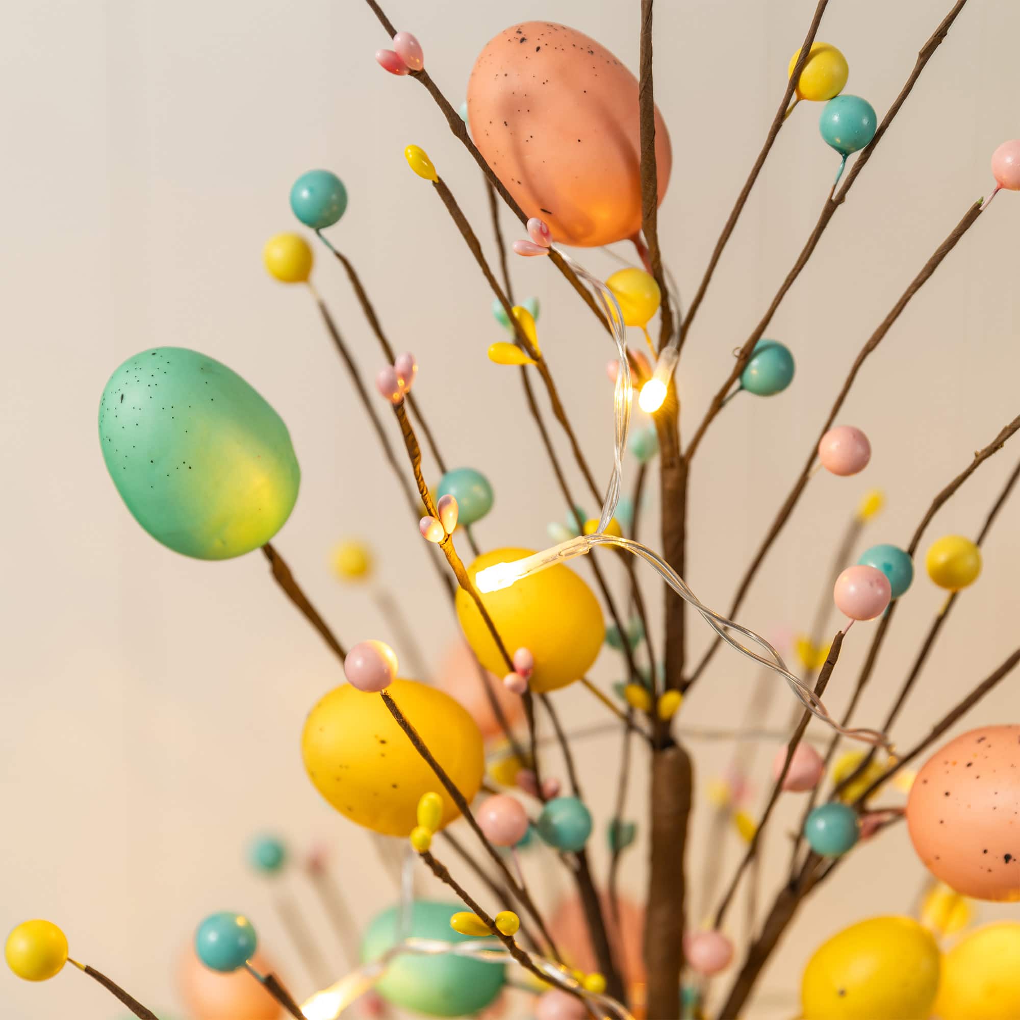 Glitzhome® 36" Lighted Easter Egg & Berries Urn Porch Tree with Timer