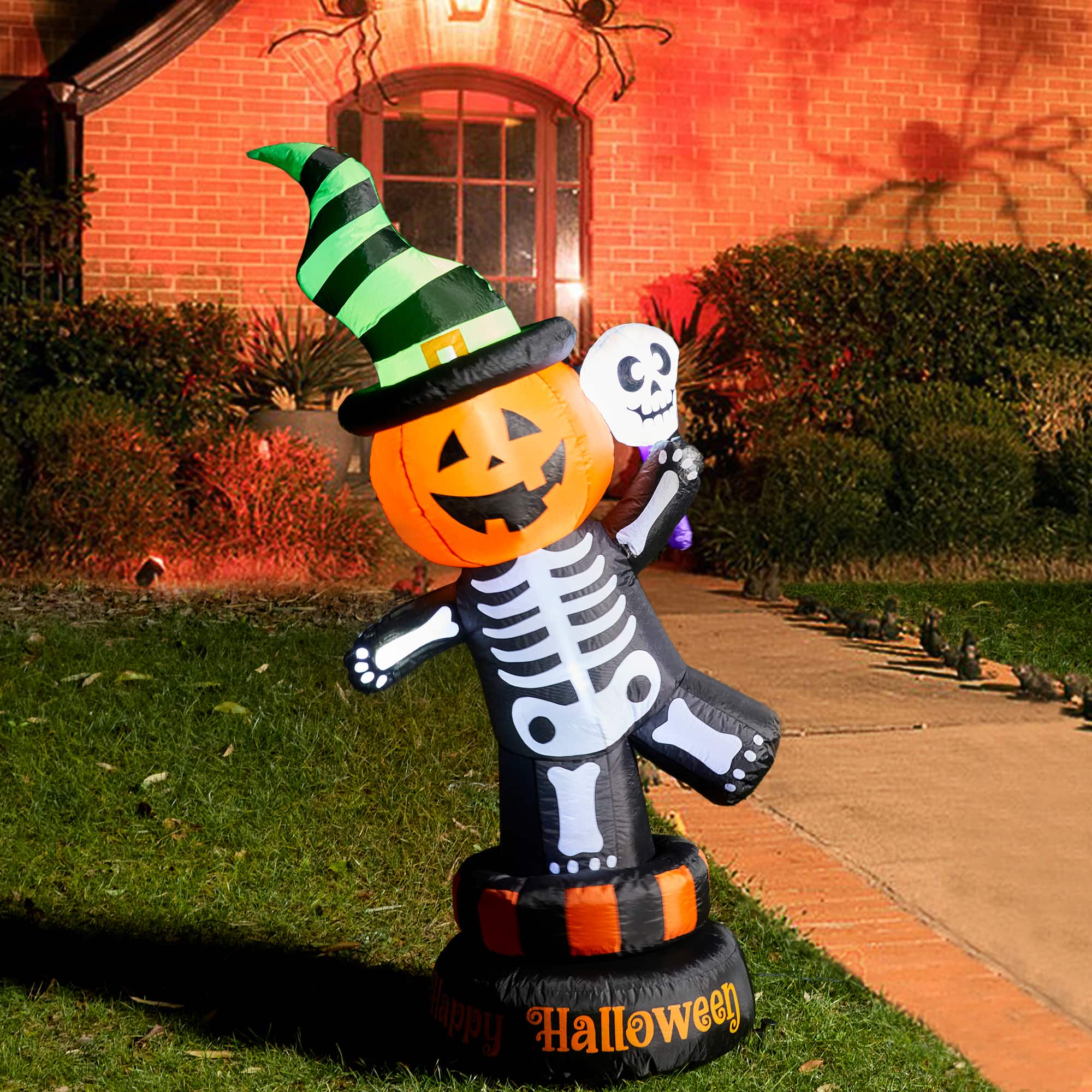 Glitzhome® 6ft. Lighted Halloween Jack-O'-Lantern Skeleton Rotating Inflatable Décor